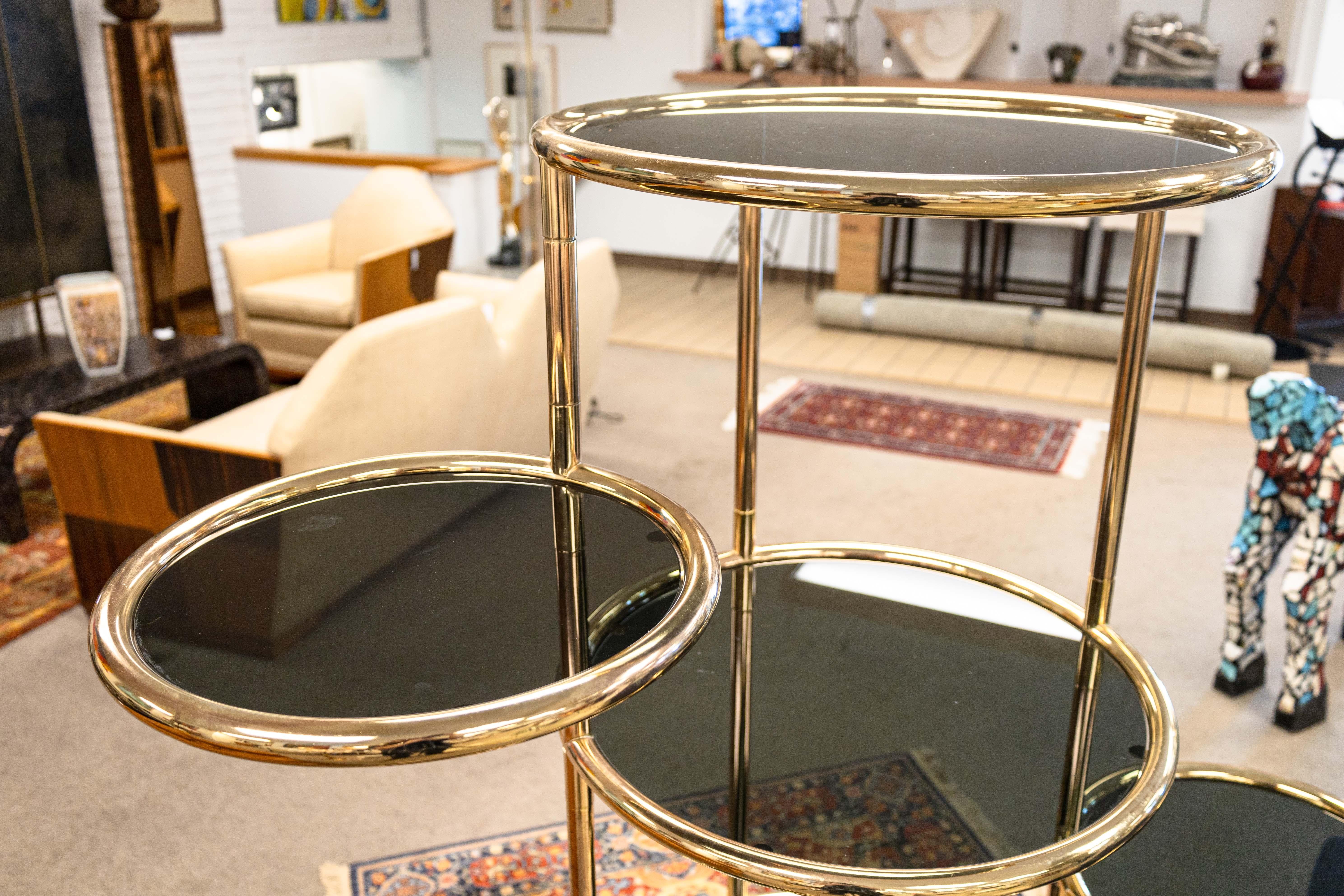 Mid-Century Modern Milo Baughman Seven Tiered Round Brass and Smoked Glass Swivel Etagere Shelving