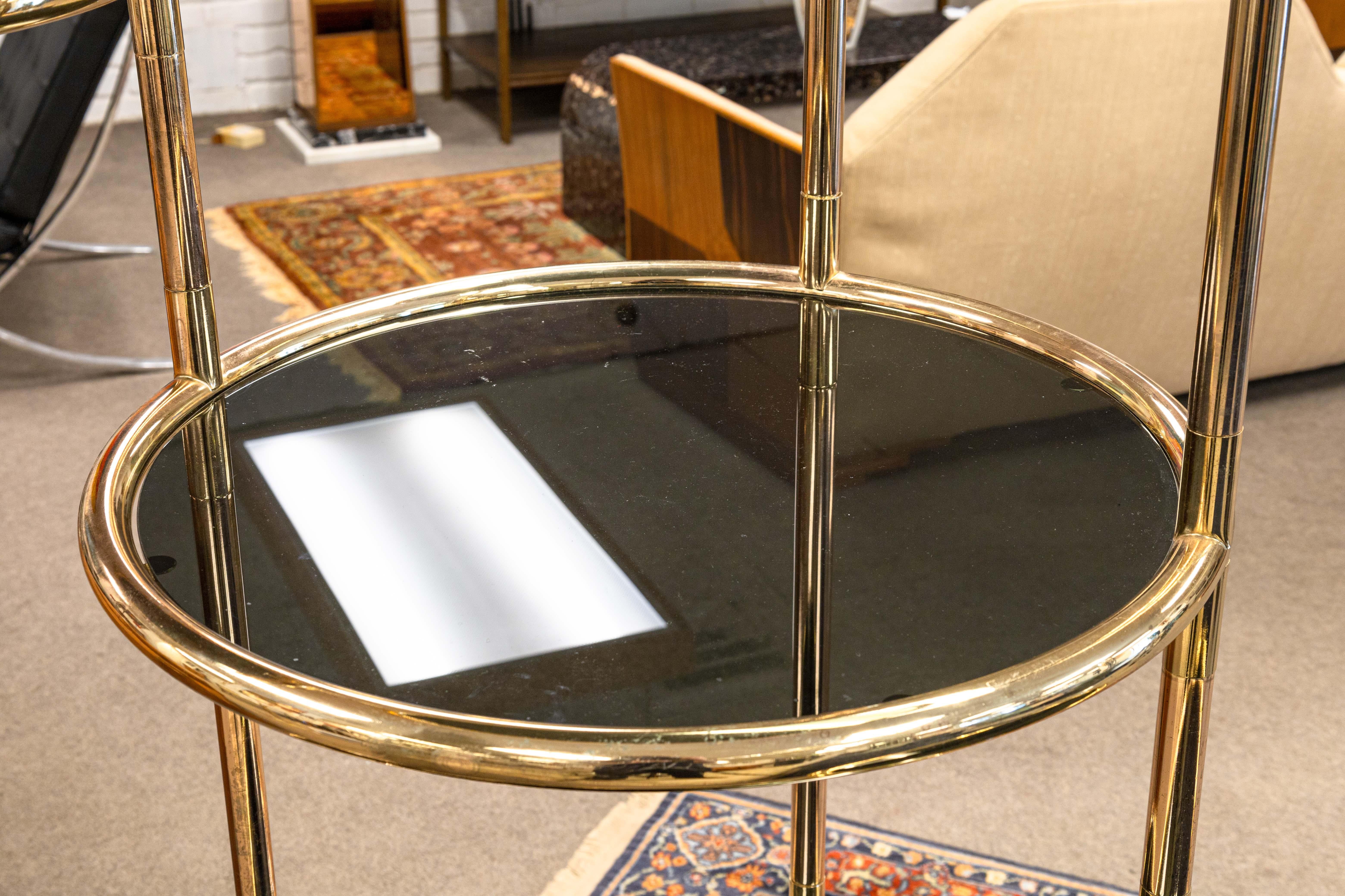 American Milo Baughman Seven Tiered Round Brass and Smoked Glass Swivel Etagere Shelving