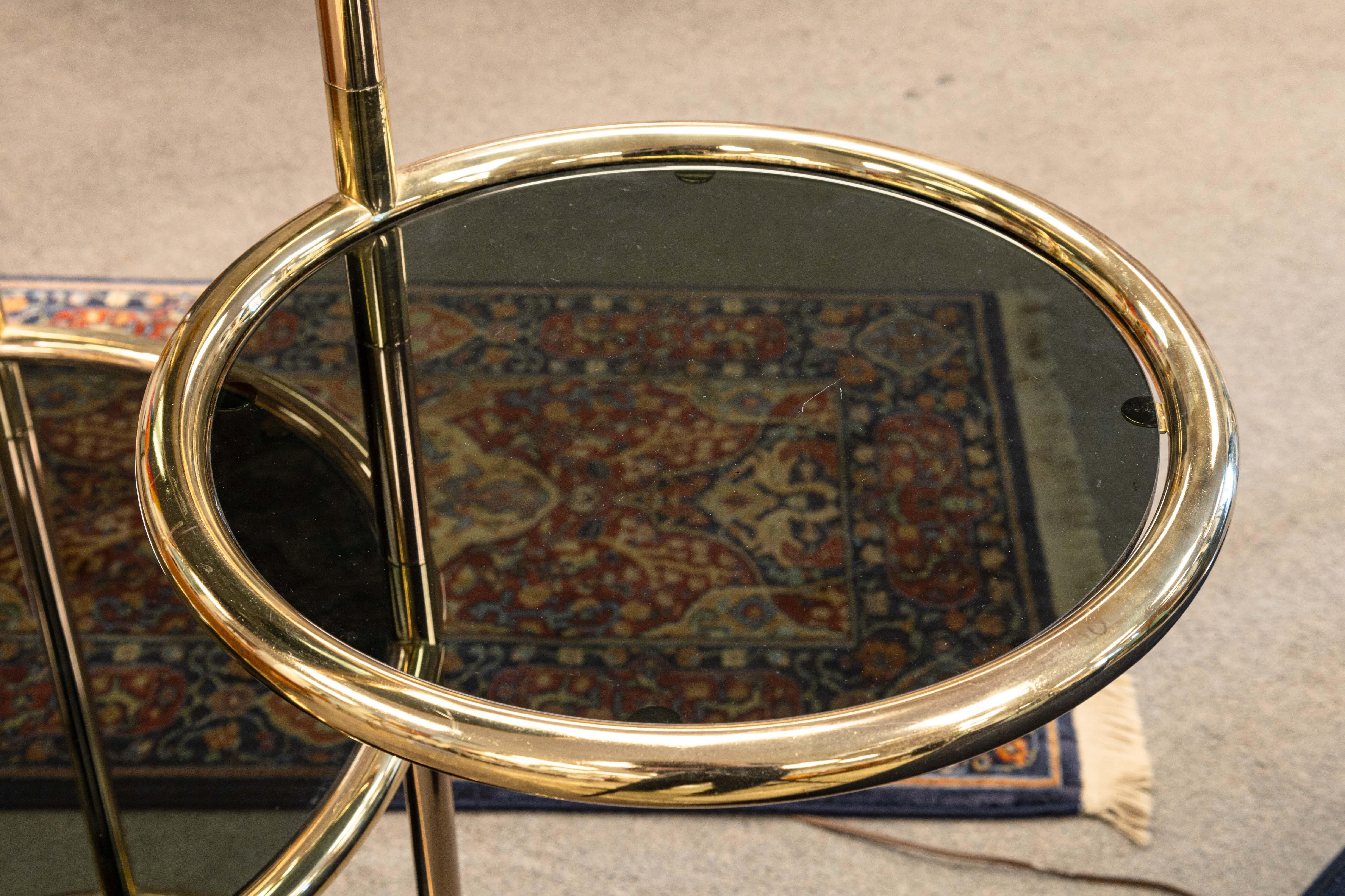 Milo Baughman Seven Tiered Round Brass and Smoked Glass Swivel Etagere Shelving In Good Condition In Keego Harbor, MI