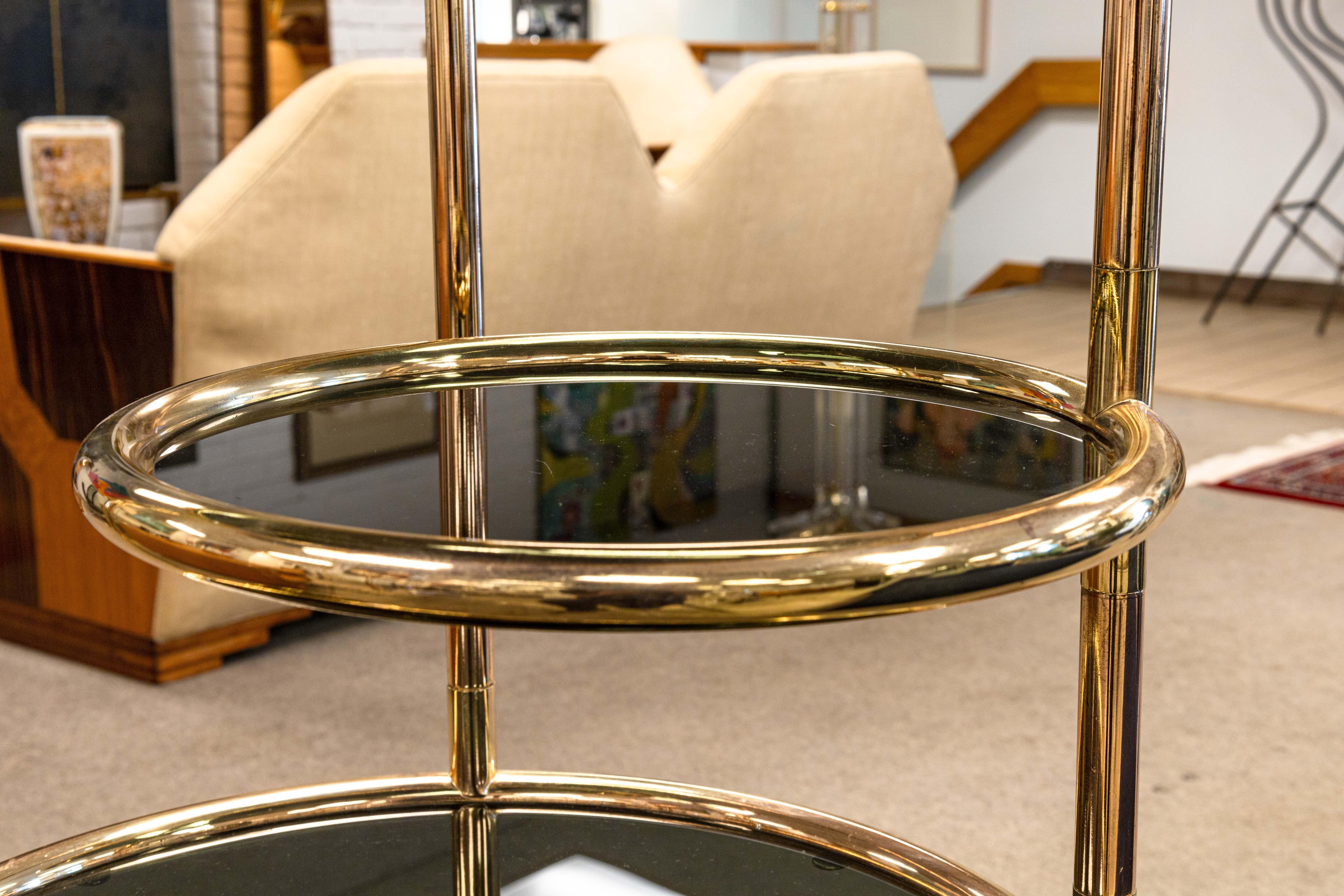 20th Century Milo Baughman Seven Tiered Round Brass and Smoked Glass Swivel Etagere Shelving
