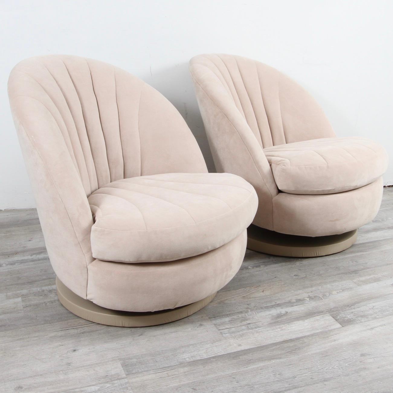 This pair of seventies vintage swivel/rocker chairs were designed by Milo Baughman for Thayer Coggin. These chairs are reminiscent of open scallop shells, the seats are deep and comfortable. Chairs rotate 360 degrees, tilt back and are mounted on