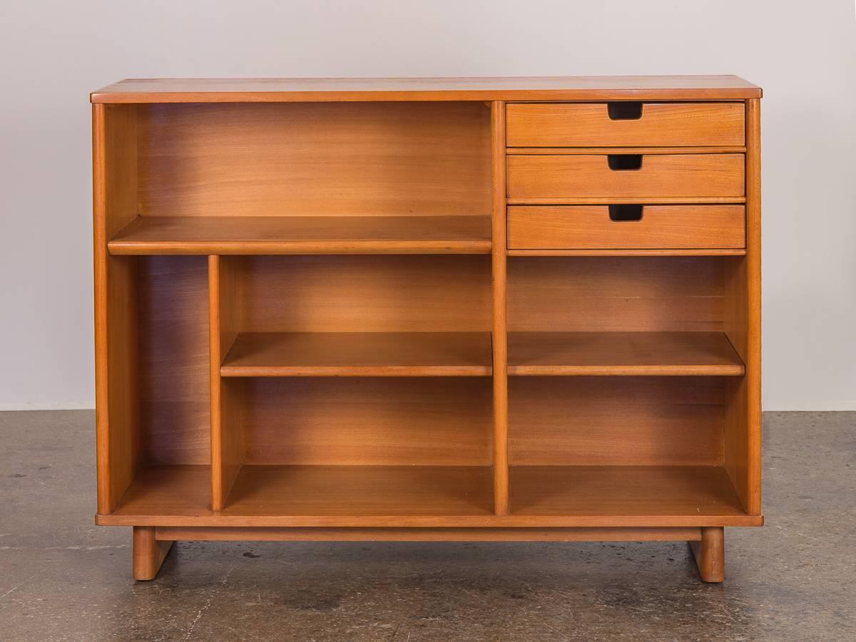 Smaller vintage cabinet designed by Milo Baughman for Drexel, 1960s. An attractive bookcase or cabinet will fit any space. Features five open shelves, and one vertical opening for wine, vinyl, monographs, or anything in between. Three drawers have