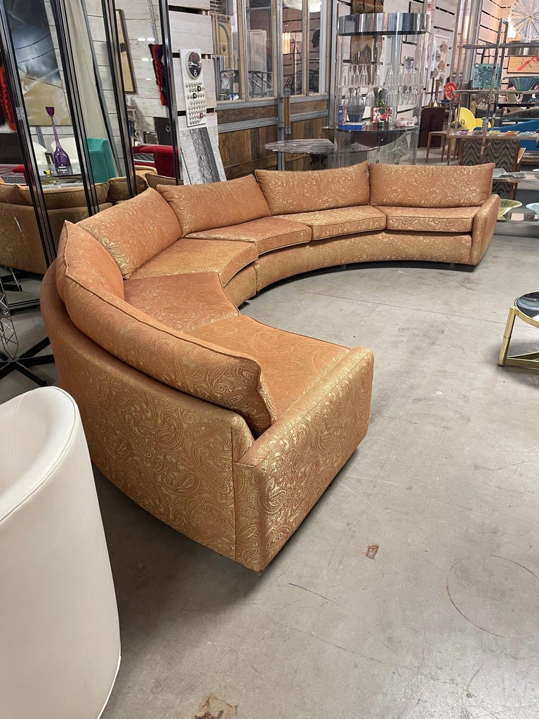 This amazing 2 piece sofa floats on a lucite base. It’s not only a great design, its very comfortable as well. Although the fabric is in good condition it could be modernized.