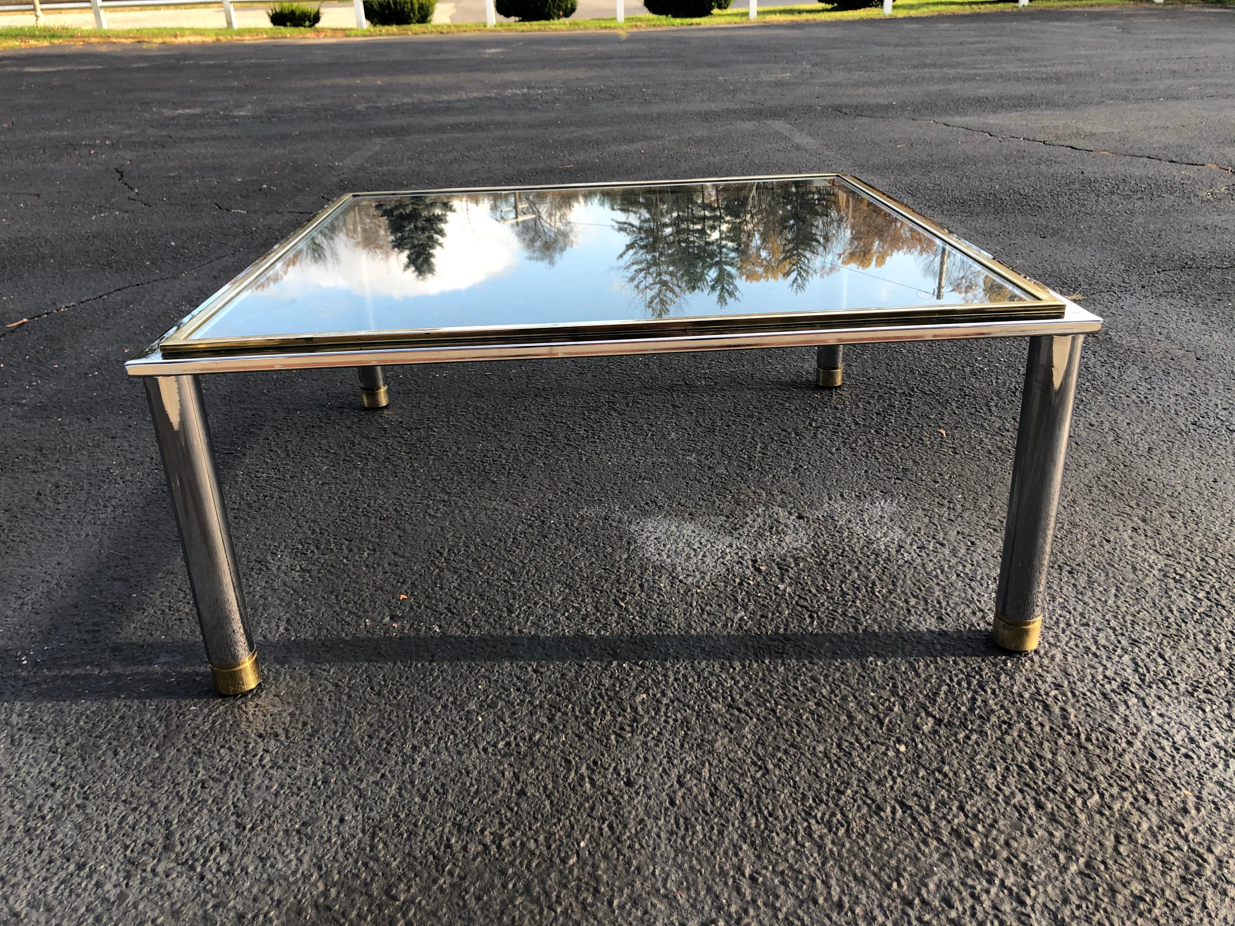 Milo Baughman Style Square brass and chrome coffee table. Sleek and sophisticated, this two toned beauty has clean, Minimalist lines to enhance any living room.