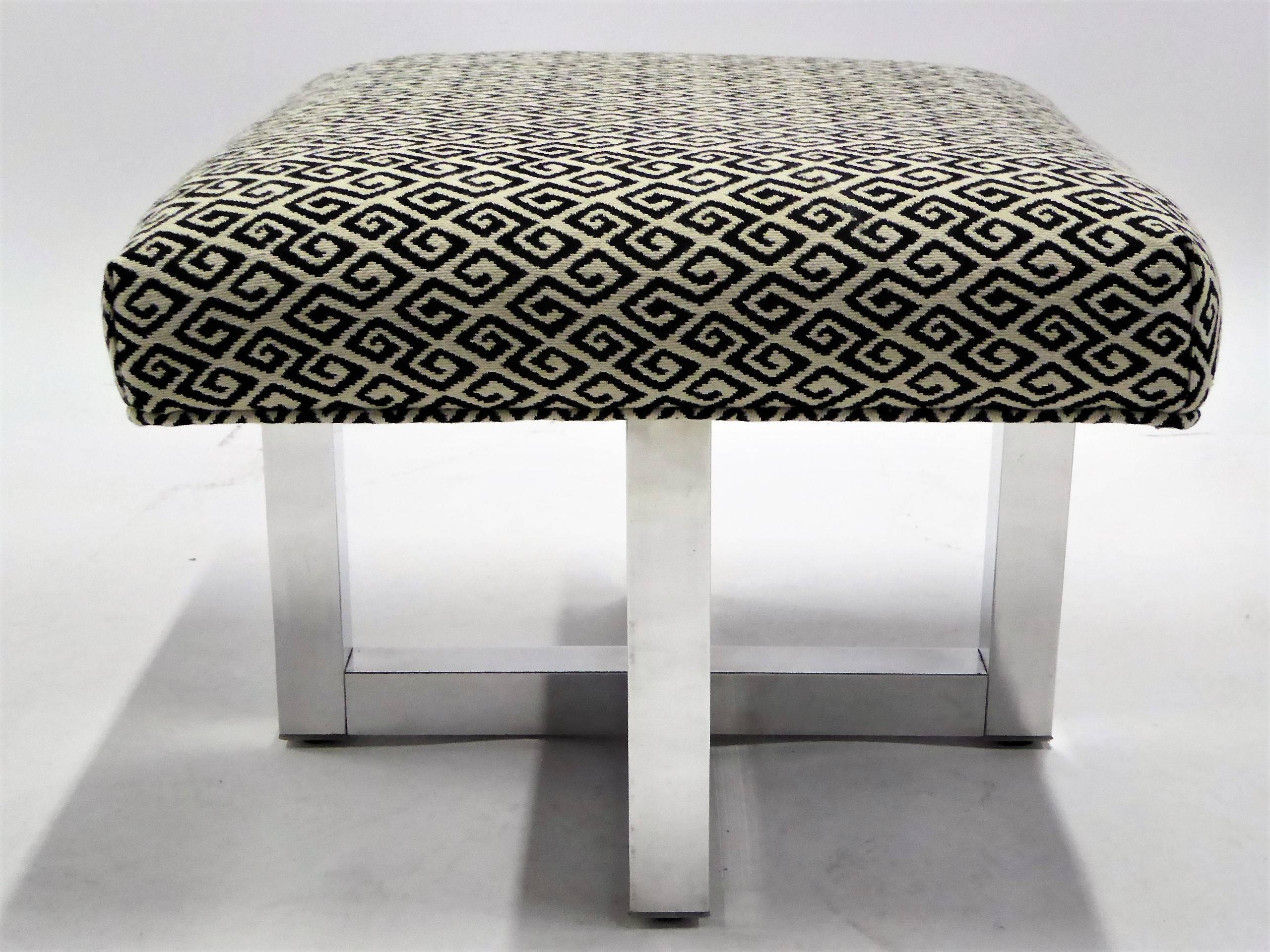 REDUCED FROM $1,500 a PAIR....Offered in pairs, from the 1960s, stools or benches in the style of Milo Baughman. With polished X-aluminum bases with superb upholstered seats in vintage woven wool Meander / Greek Key motif fabric with welting. Sold