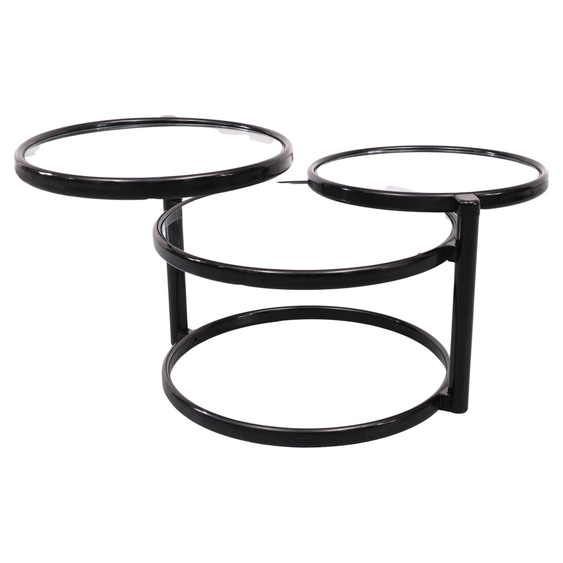 Very nice Three tier circle expandable coffee table. so easy in use. 
if you need more space just pullout a extra leaf. Black color base.