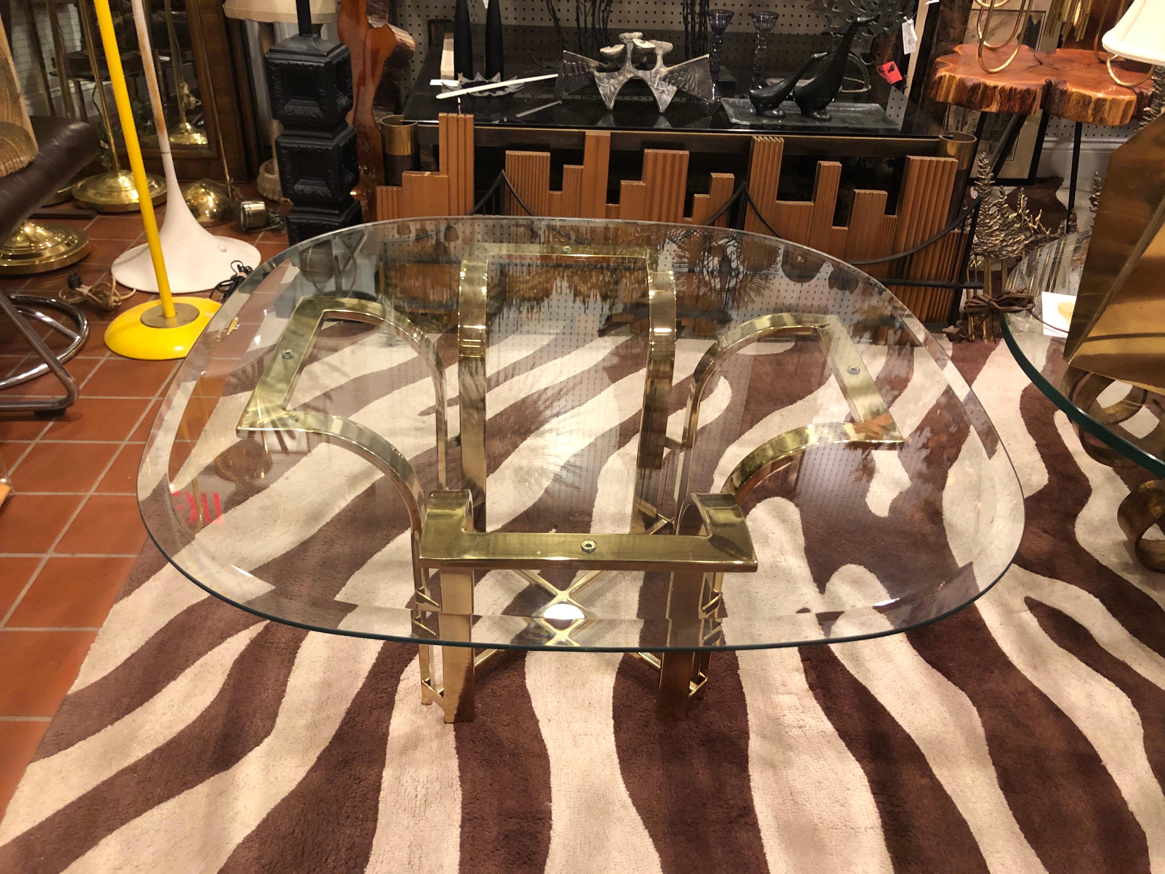 Milo Baughman style brass and glass coffee table. X base stretcher with a 1.25