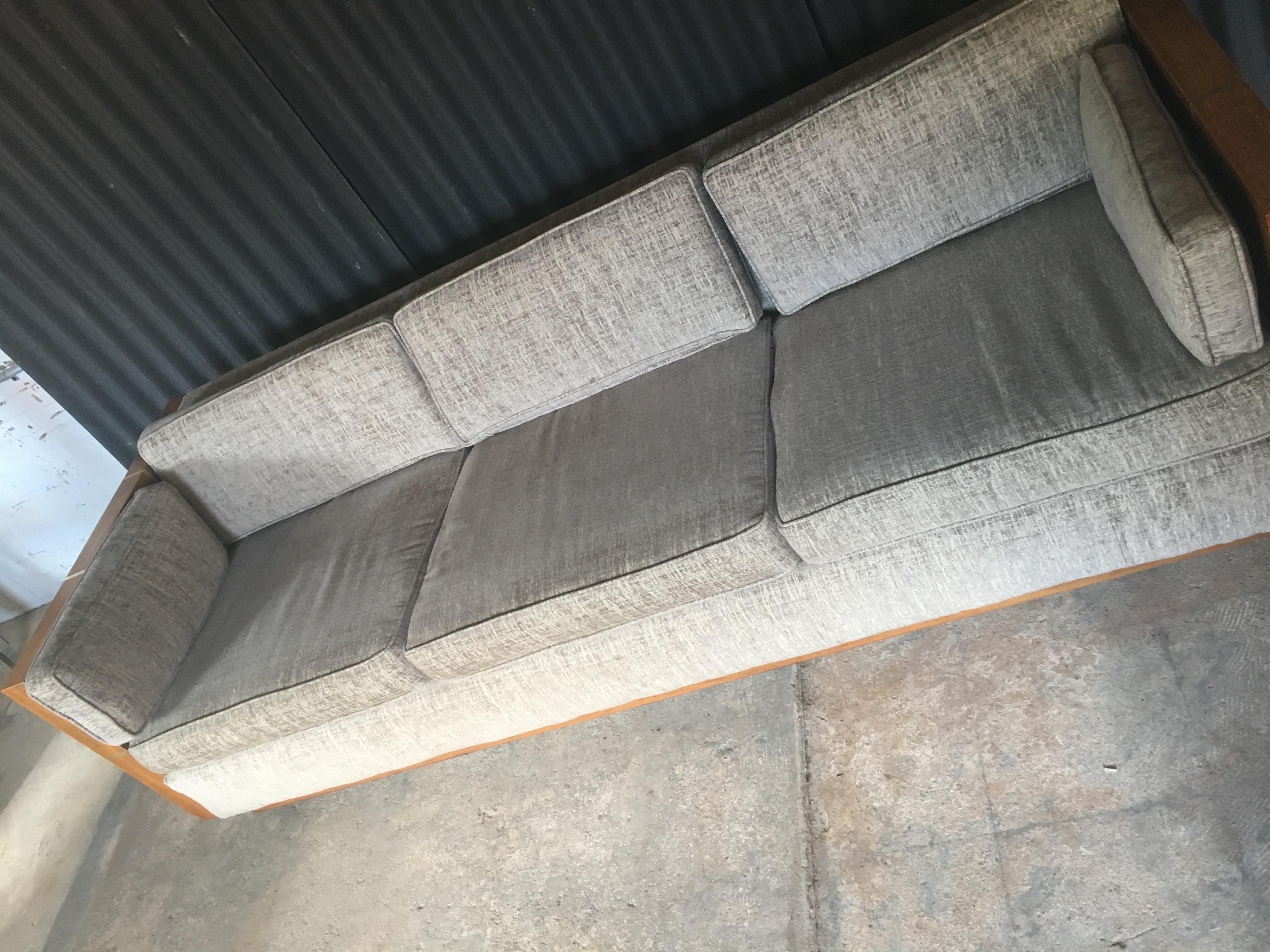 Incredible case sofa in the style of designer, Milo Baughman.
This piece came to us in simply beautiful condition and was recently reupholstered in this clean and modern fabric. Fabric is in Fantastic condition with no signs of wear at all. One up