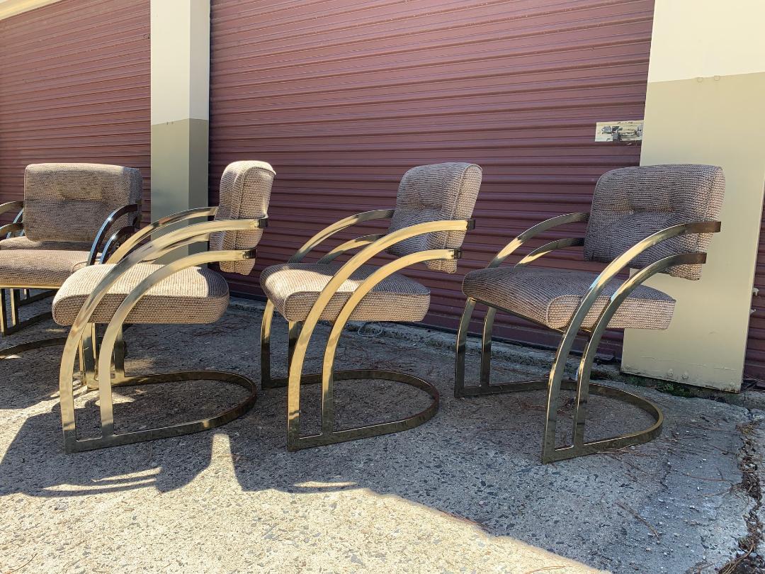 A beautiful set of 6 cantilever dining chairs by Cal-style in the manner of Milo Baughman having sexy double banded brass frames with amazing lines. 
Outstanding vintage condition.
