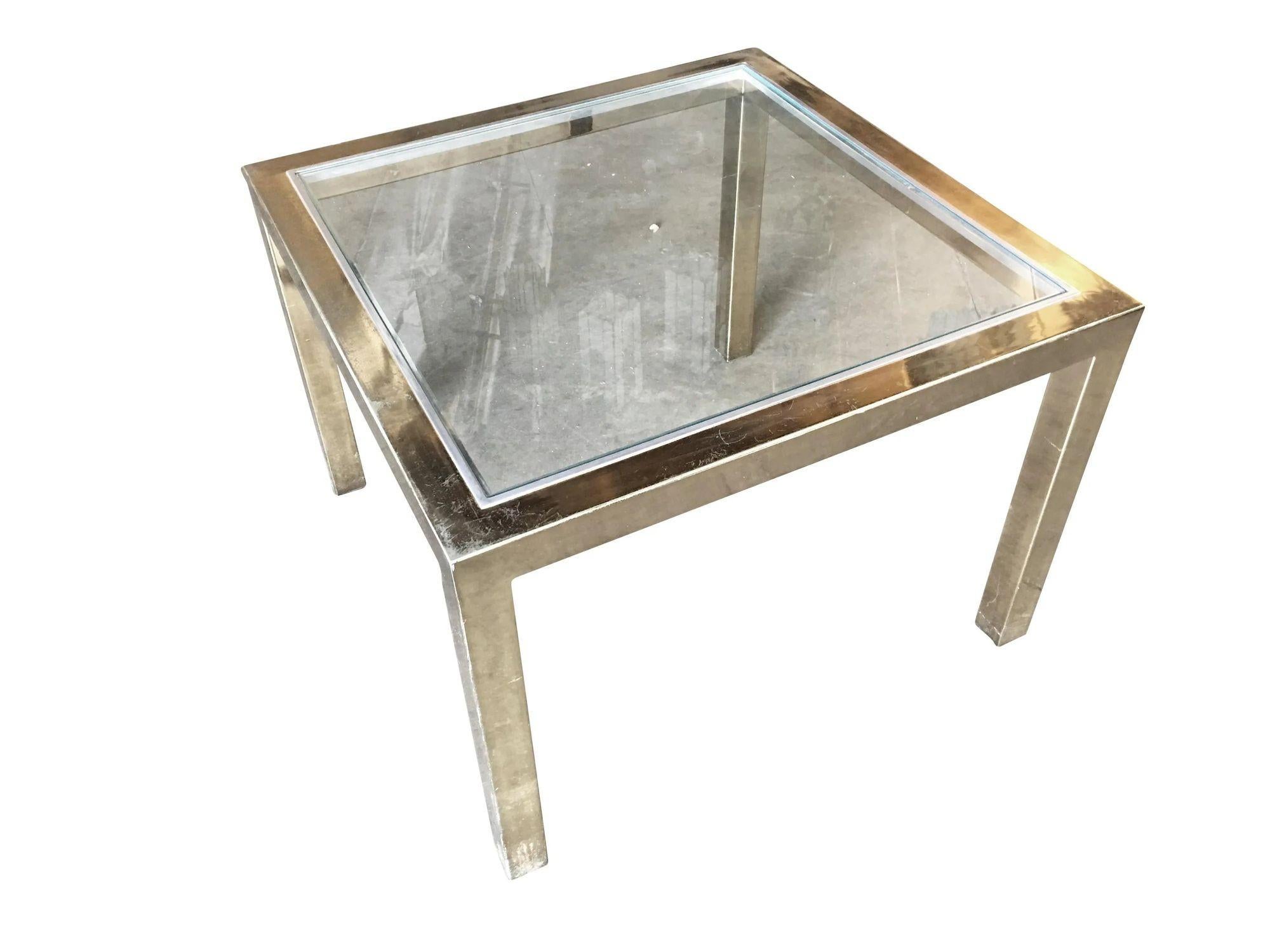 Vintage Milo Baughman brass plated side table with glass top and decorative brushed metal border. This table is in excellent condition.

Dimension: 22