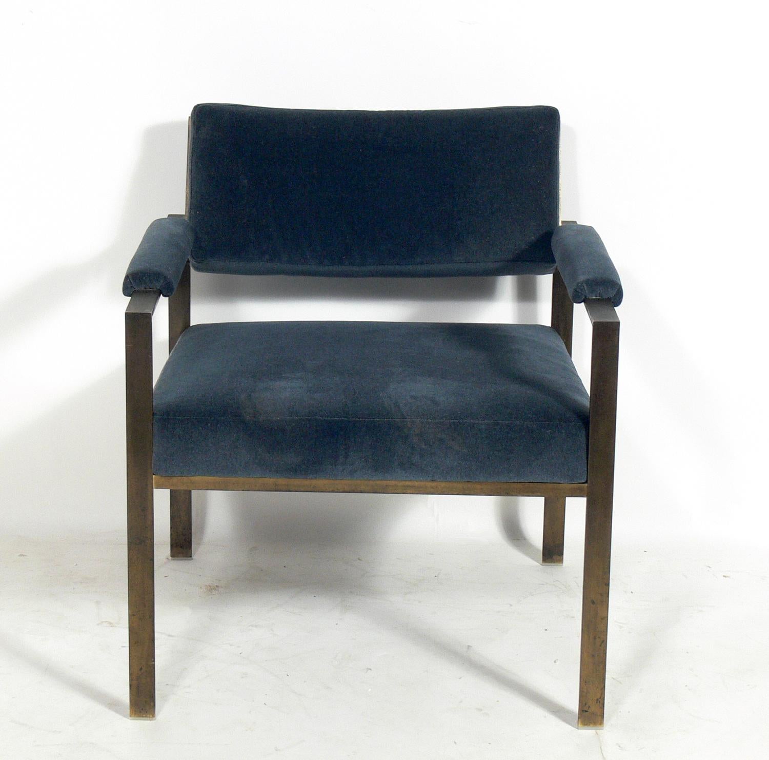 Clean lined midcentury lounge chair, in the manner of Milo Baughman or John Vesey, circa 1960s. It has a bronze finished metal frame and has been reupholstered in a deep blue velvety fabric. Bronze finished frame retains warm original patina.