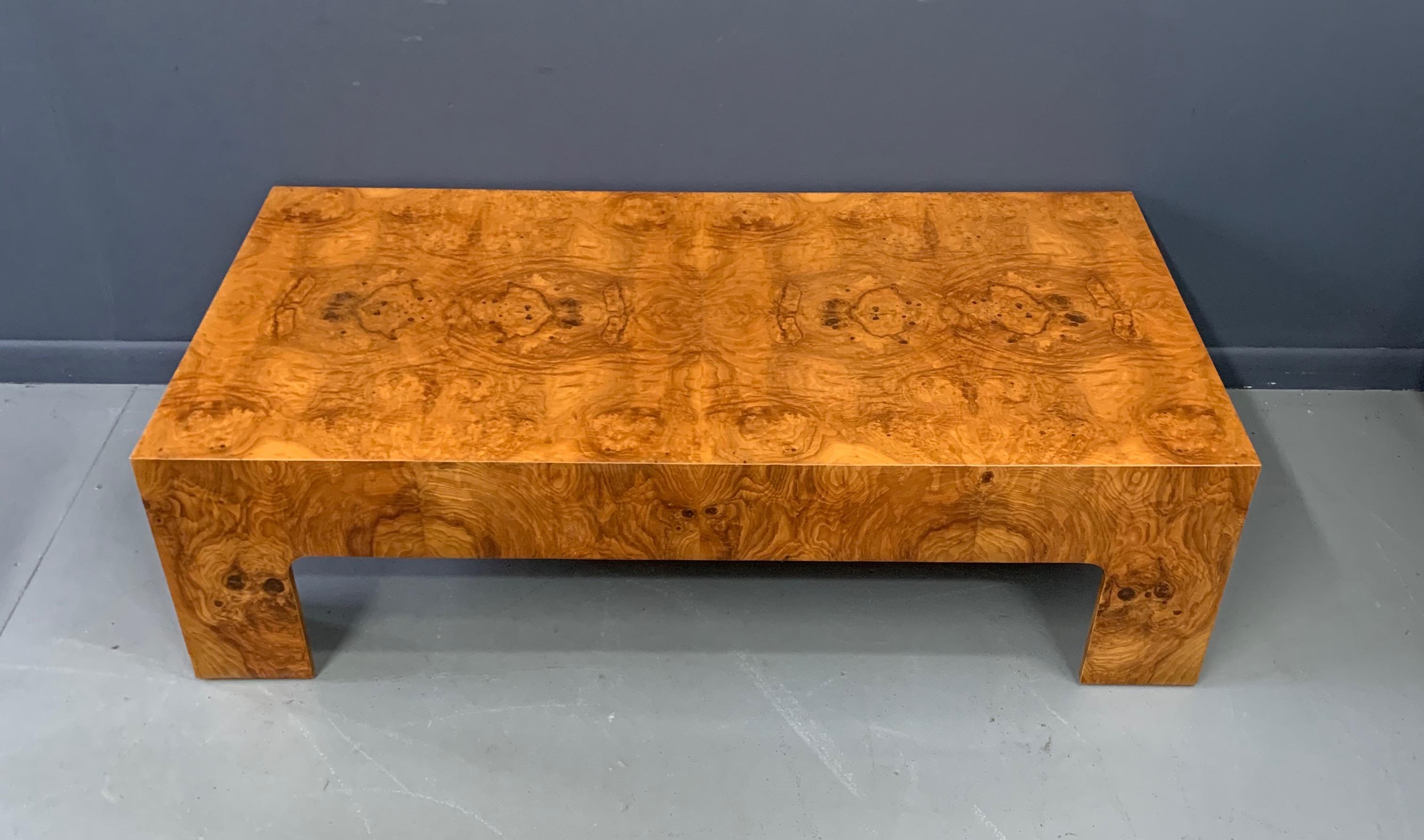 An incredible display of book matched burl, this coffee table has classic midcentury lines that will complement any decor.