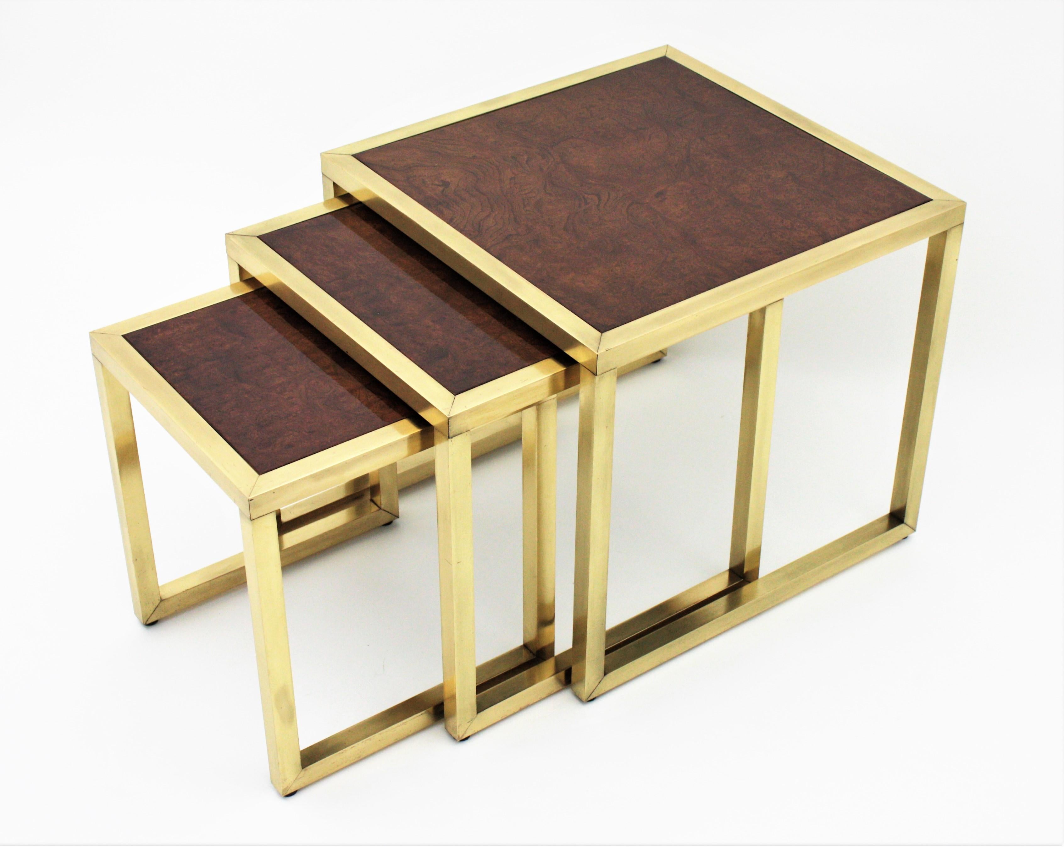 Elegant set of three ash burlwood and brass nest of tables, Spain, 1960s.
This nest of tables features a clean and great design in the style of Milo Baughman.
They will add a Modernist accent to any place and can be displayed as nesting tables or a