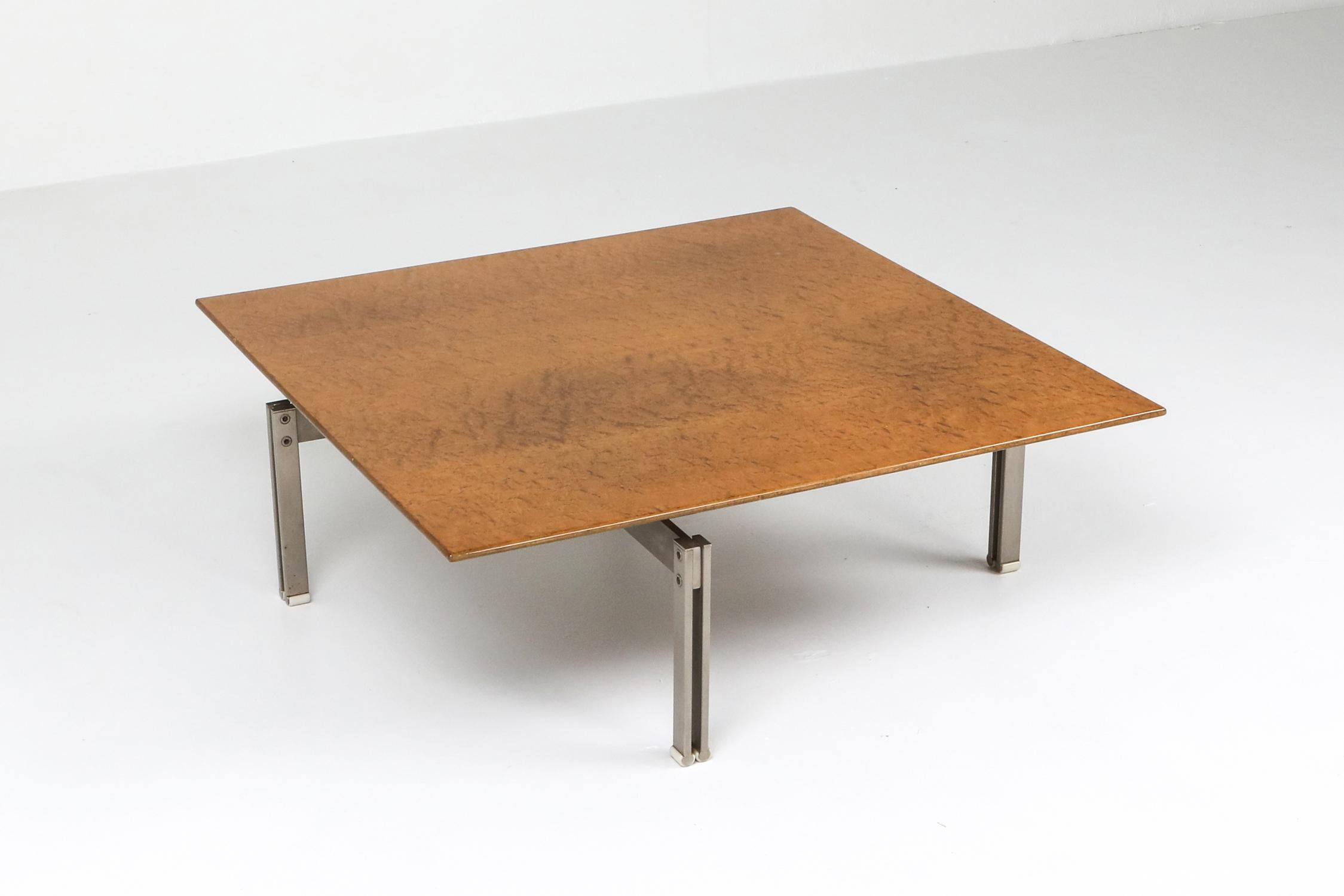 Mid-Century Modern square coffee table in the style of Milo Baughman. Made out of burl wood with a steel base. Made in the United States, circa 1970s.