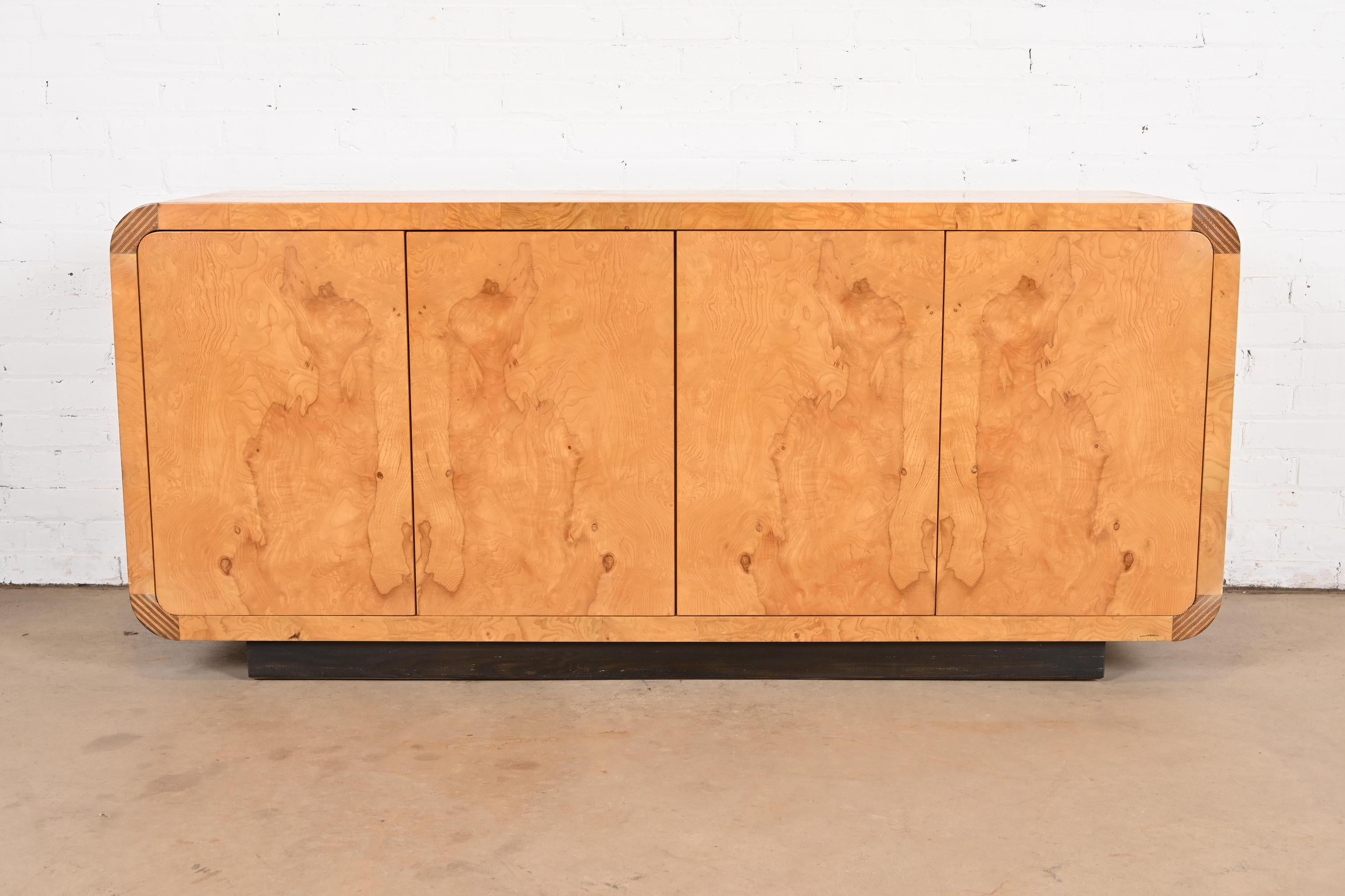 A gorgeous Milo Baughman style Mid-Century Modern burl wood sideboard, credenza, or bar cabinet

By Henredon, 