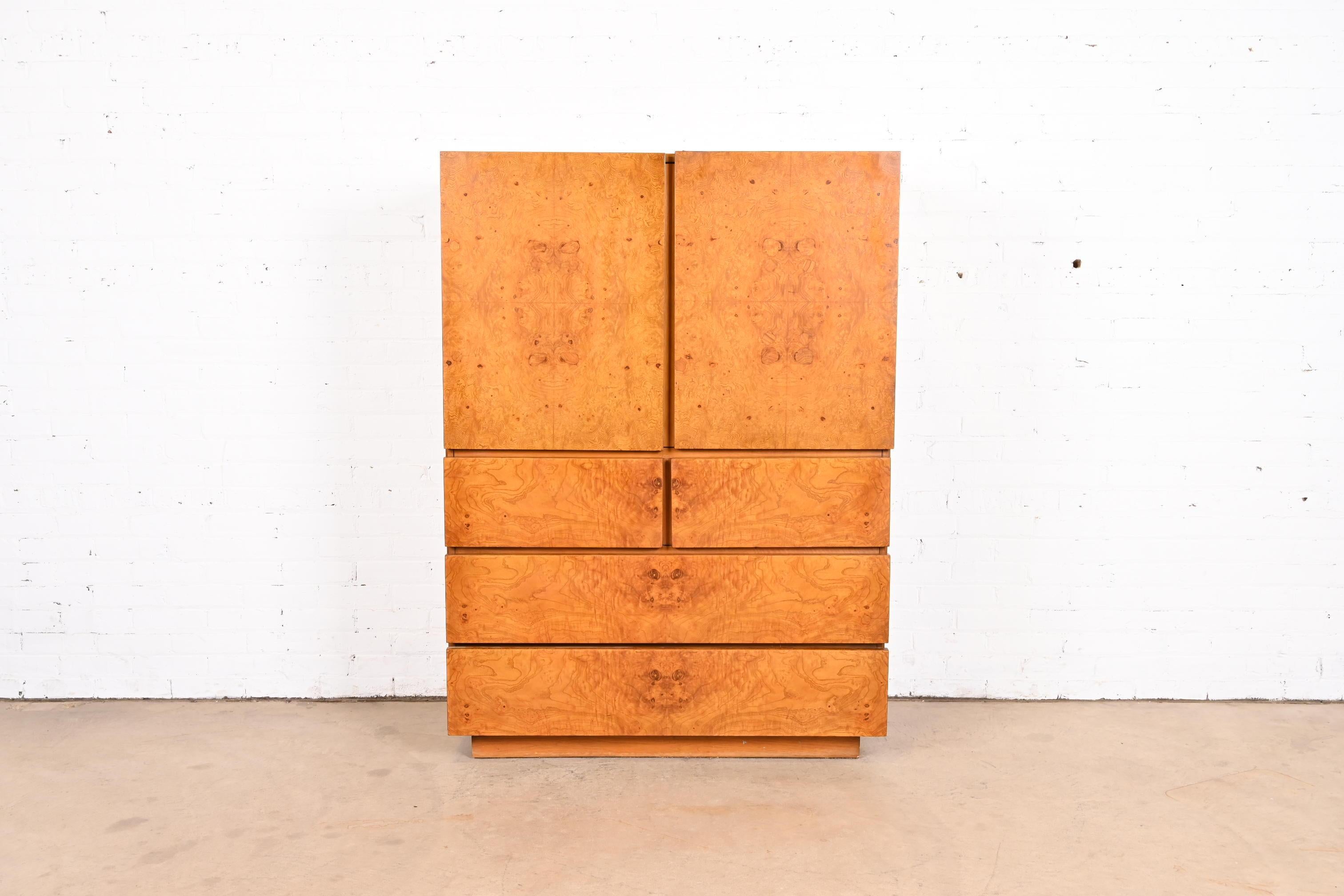 A gorgeous Milo Baughman style Mid-Century Modern burl wood gentleman's chest or armoire dresser

By Lane Furniture

USA, 1970s

Book-matched burled olive burl wood, with ash wood case.

Measures: 42