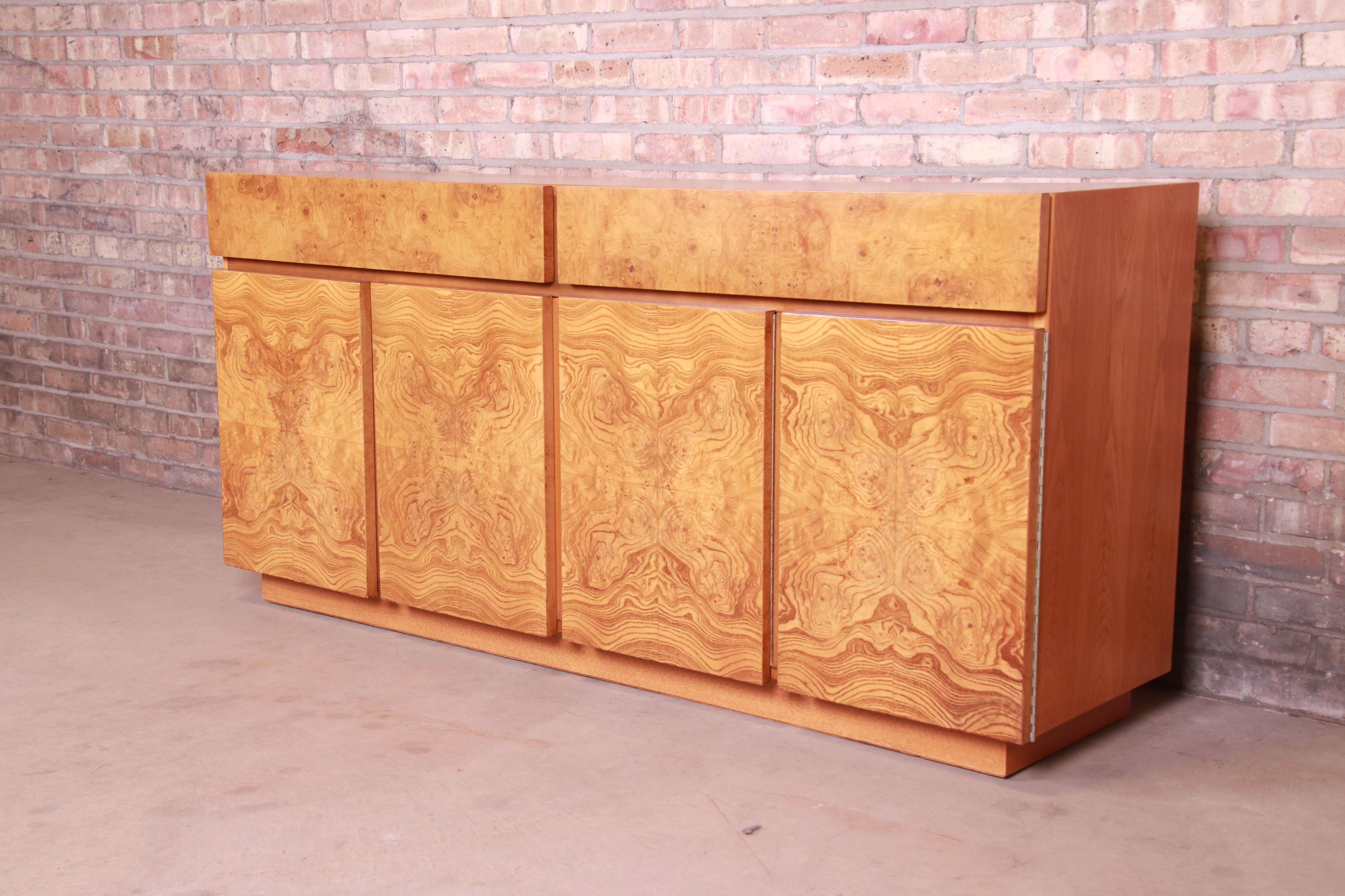 A gorgeous Milo Baughman style Mid-Century Modern sideboard, credenza, or bar cabinet

By Lane Furniture

USA, 1970s

Book-matched burled olive wood, with ash wood case.

Measures: 67.75