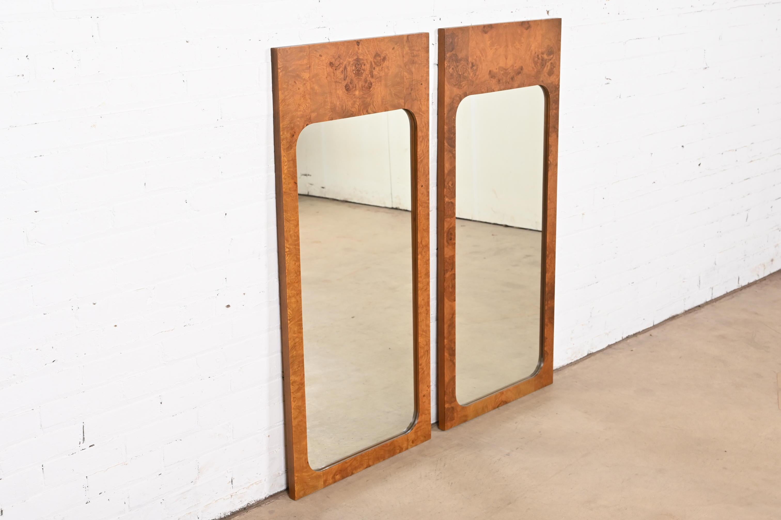 A gorgeous pair of tall Mid-Century Modern burl wood wall mirrors

In the manner of Milo Baughman

By Lane Furniture

USA, 1970s

Measures: 21.25