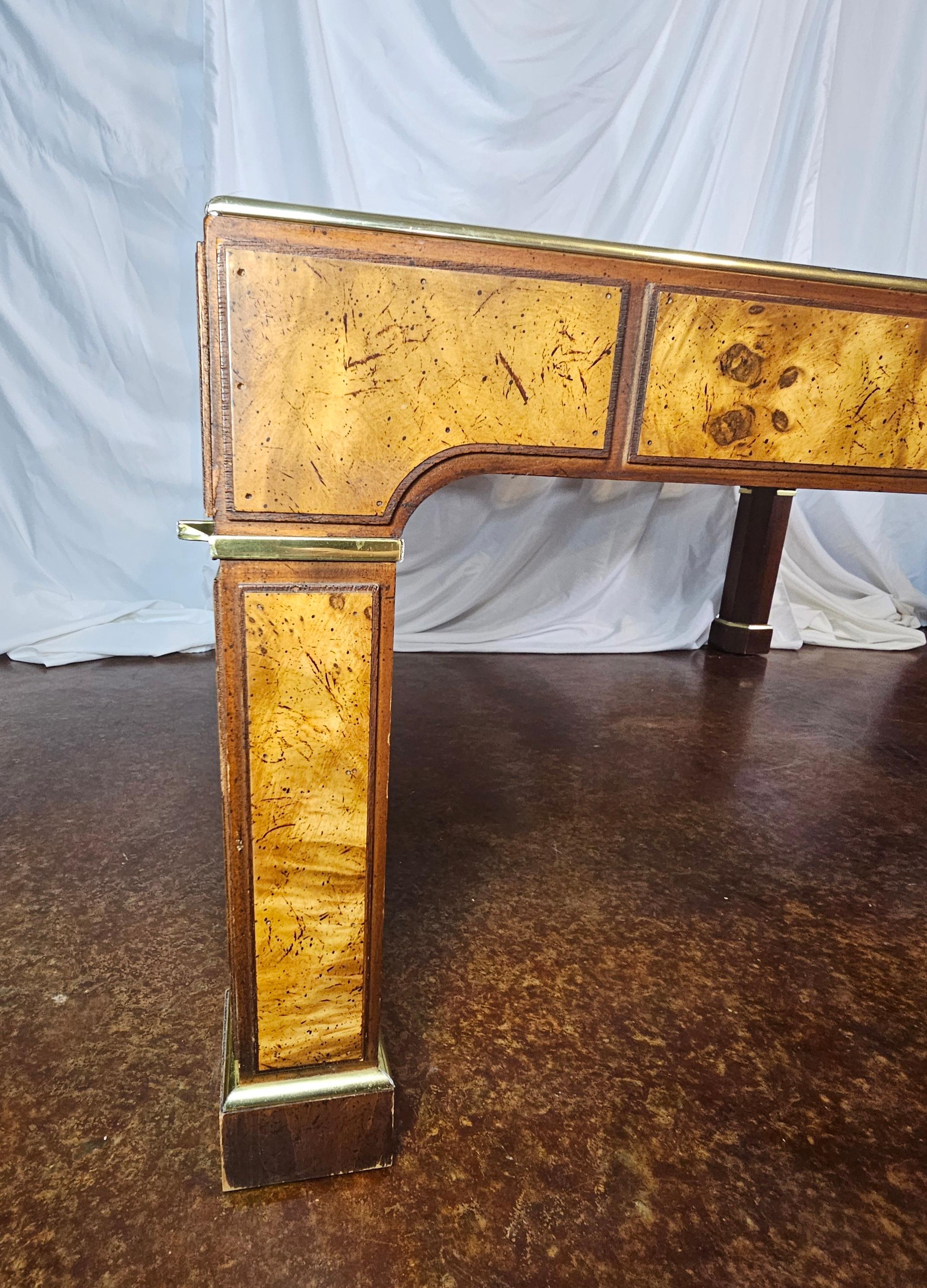 Vintage 1970s burlwood and glass coffee table with brass accents. 
Smoked, beveled glass, lifts out.
Stunning use of burlwood accents. 
In the style of Milo Baughman or Mastercraft. 
Hollywood Regency. 
Chinoiserie. 
