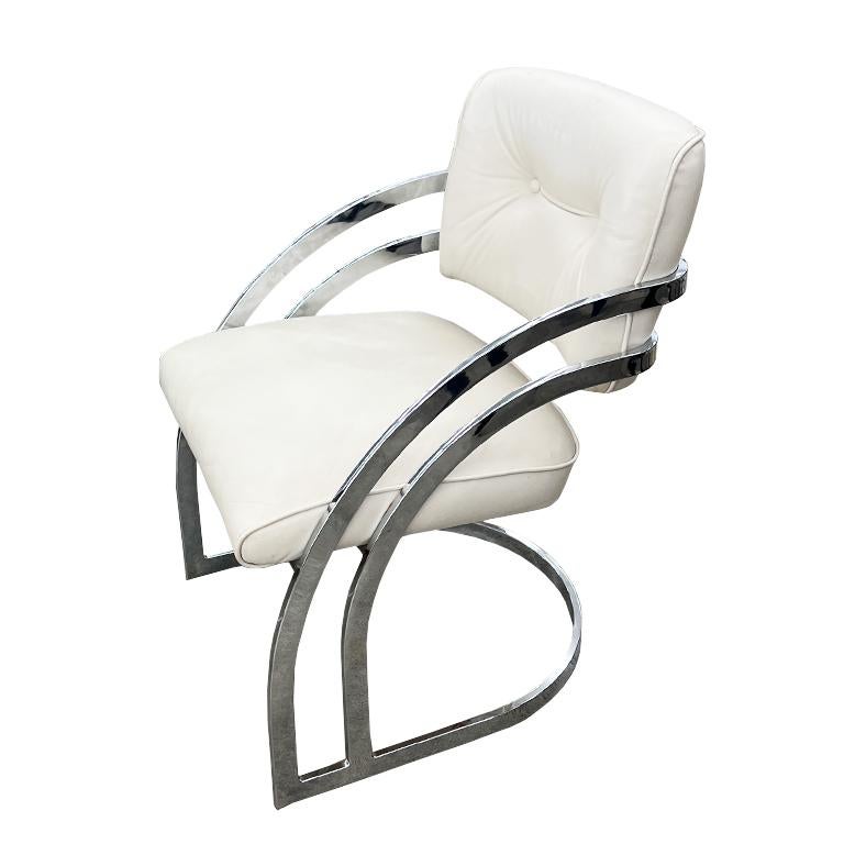 A set of 5 1970s Mid Century Modern cantilever chrome and white dining chairs. This set features five cantilever chairs upholstered in a mixture of white faux leather, and white faux fur. (Three in faux leather and two with faux fur seats and gold