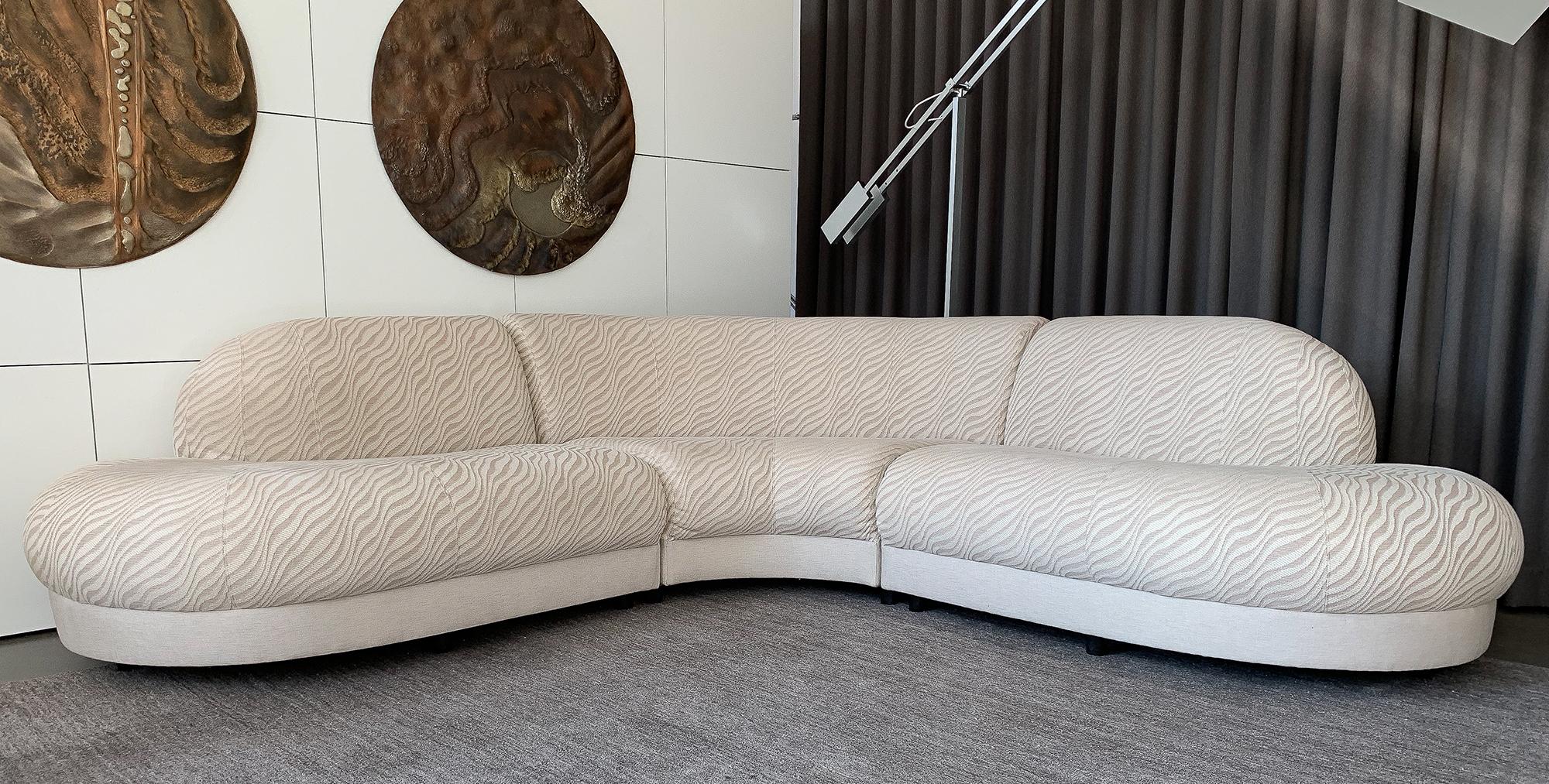 Curvaceous armless three-piece sectional sofa in the style of Milo Baughman. Symmetrical L shaped 102