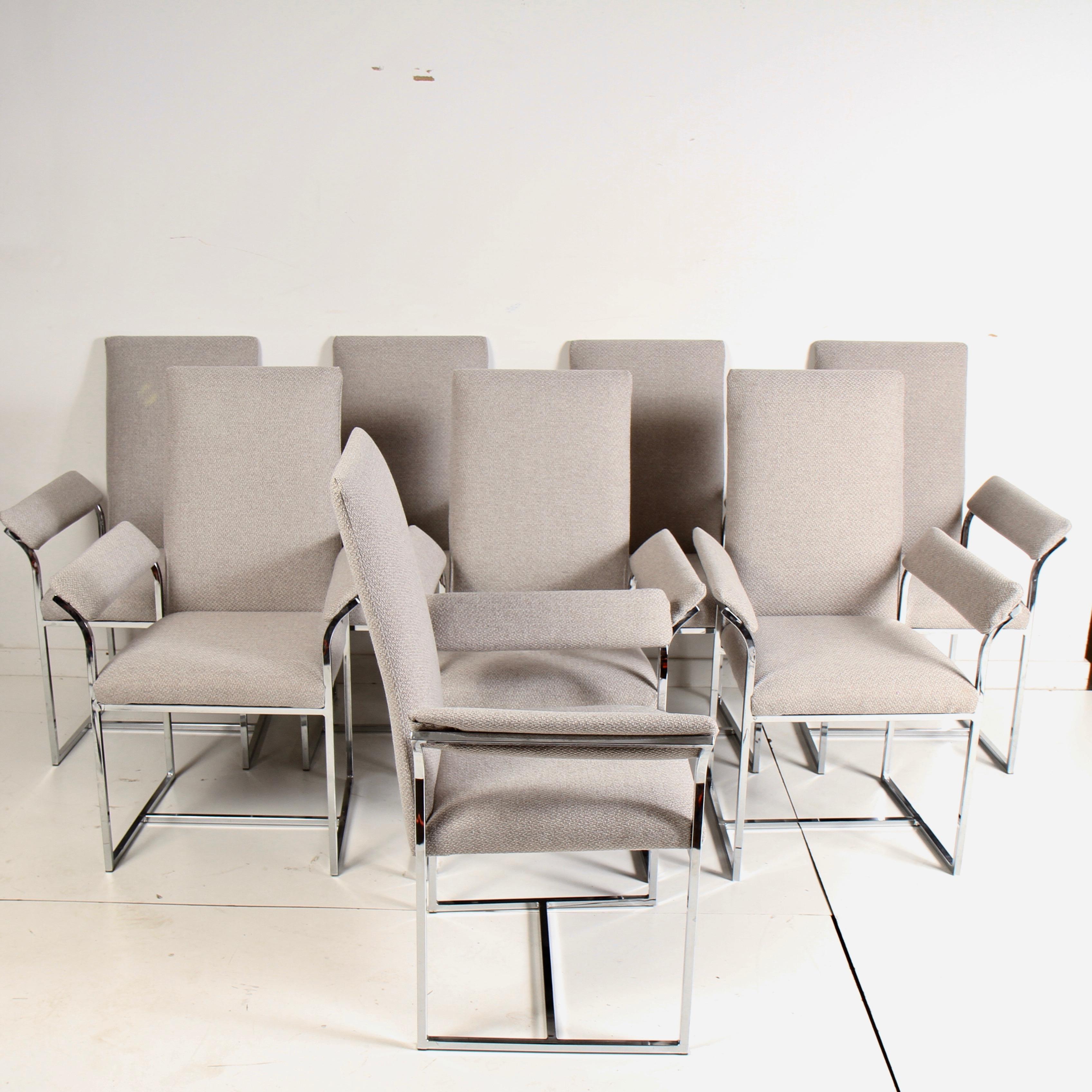 Set of 8 armchairs in the manner of Baughman that are freshly reupholstered and ready for another 40 years of entertaining. Chrome frames are in very clean original condition with no pitting or corrosion of any kind. Fabric is a light grey weave.