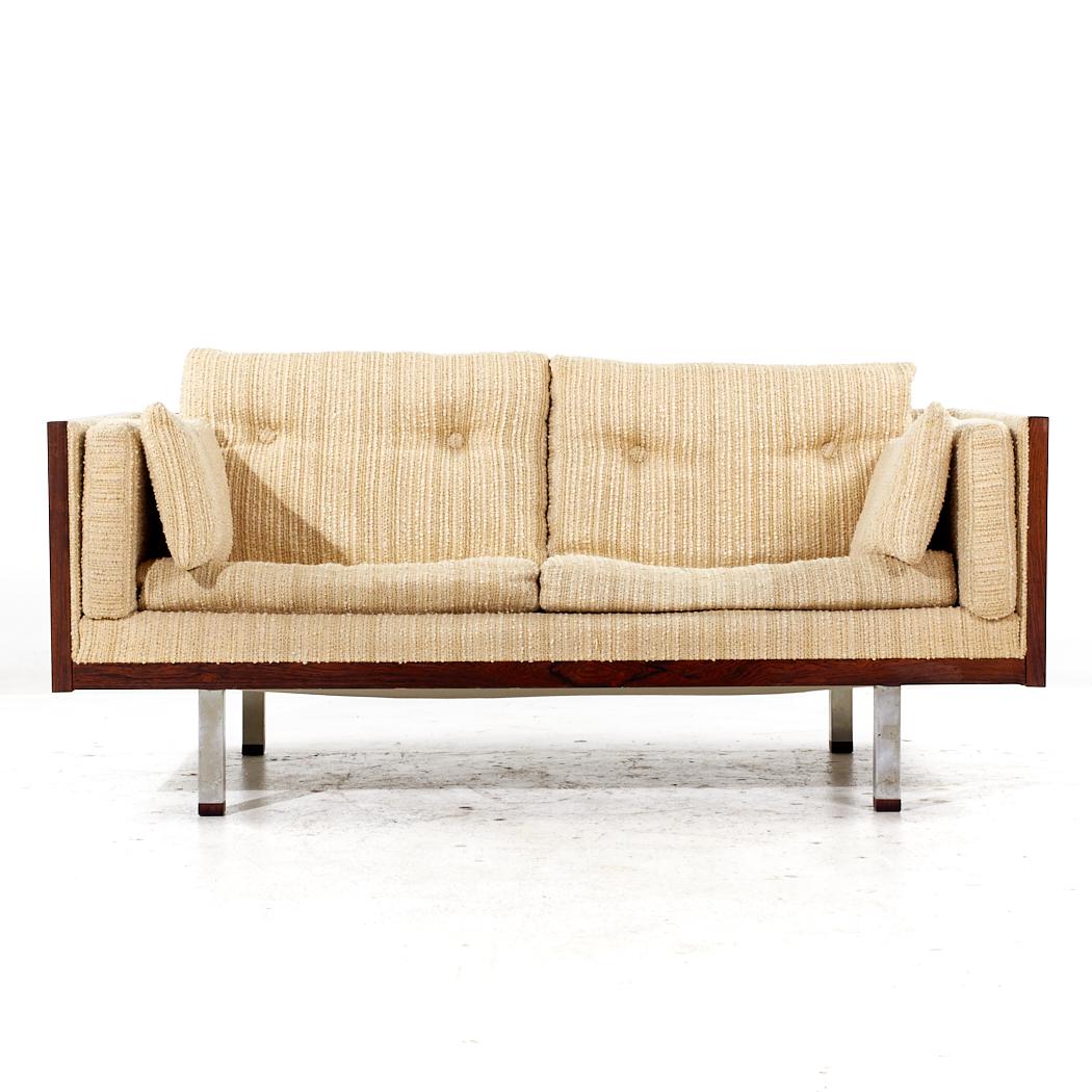 Milo Baughman Style Jydsk Mobelfabrik Mid Century Danish Rosewood Case Settee

This settee measures: 61.5 wide x 30.5 deep x 29 inches high, with a seat height of 16 and arm height of 24.5 inches

All pieces of furniture can be had in what we call