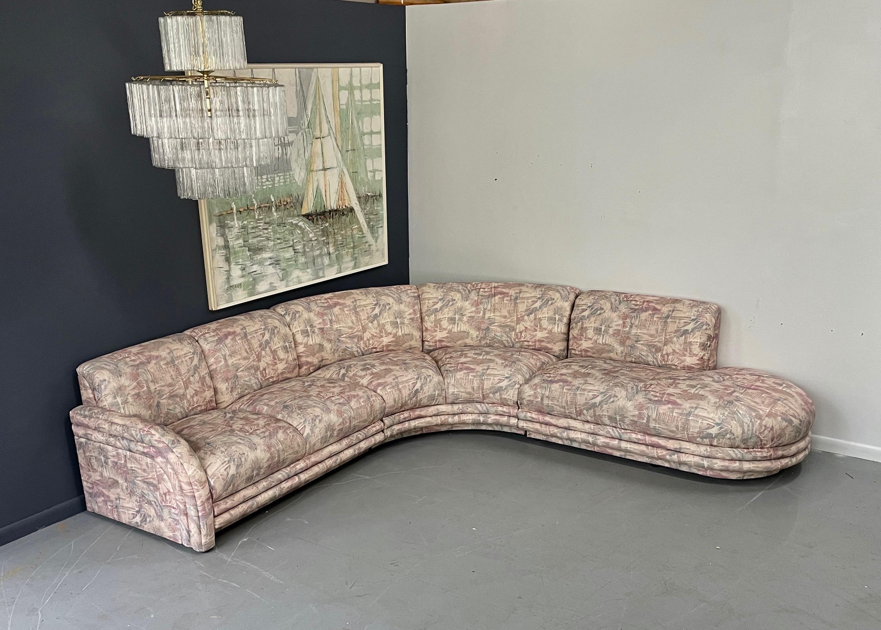 Wonderful sofa with great channeling and fluid shape. This sofa is in the original fabric. We would suggest re-upholstering, the charge would be $1250 with COM.

From the wall one side measures 116