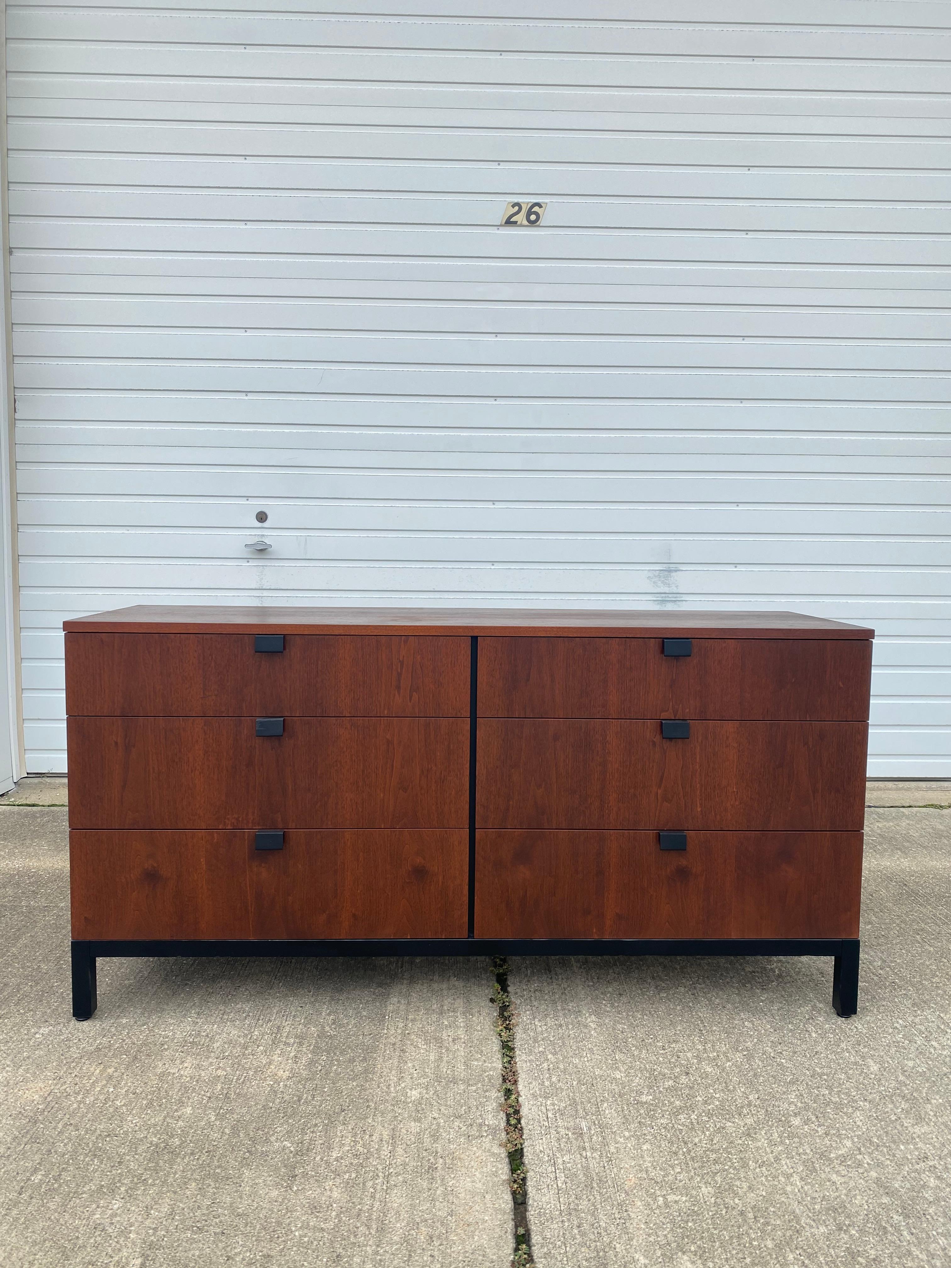 A Modern tallboy dresser designed by Milo Baughman for Directional from the Gallery I Collection, circa 1963 has been partially refinished to show off its beautiful walnut wood and new black lacquer on its handles and legs. This lowboy dresser has 6