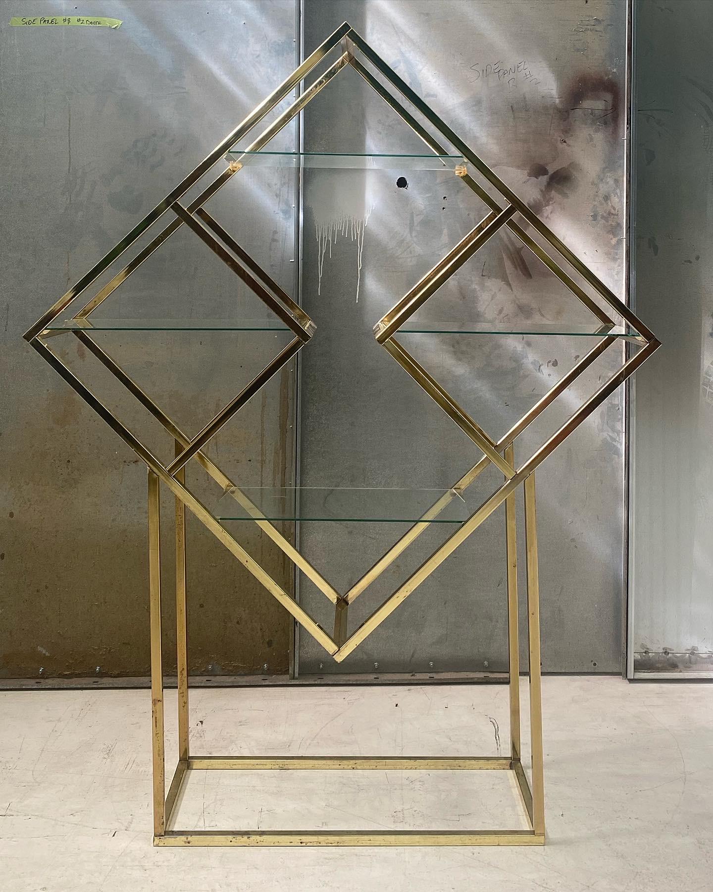 Diamonds are anyones best friend. On Offer is a stunning brass anodized aluminum diamond shaped etagere with four 