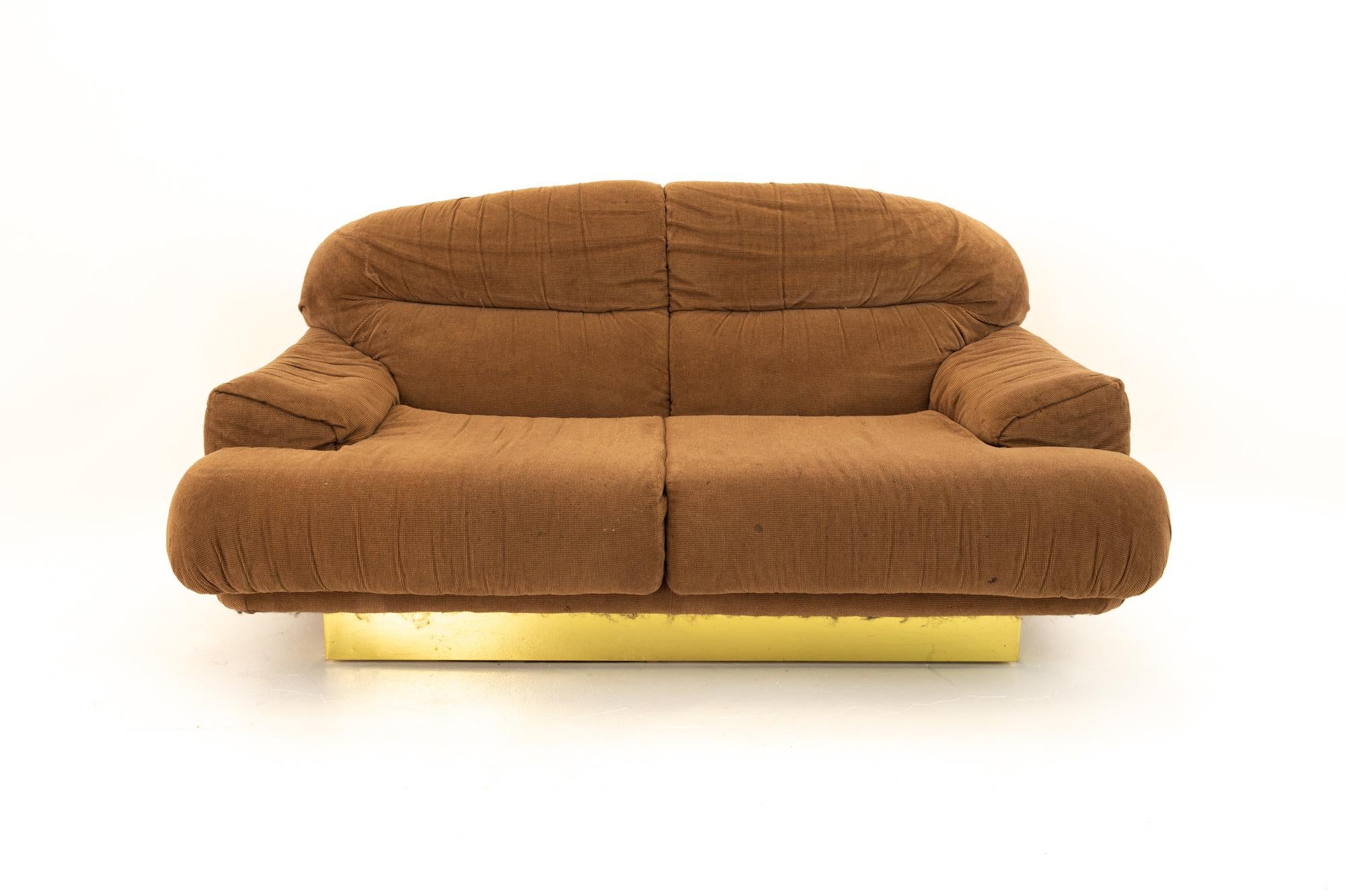 Milo Baughman style mid century brass base sofa
Sofa measures: 59 wide x 39 deep x 32 high with a seat height of 14 inches

This price includes getting this piece in what we call restored vintage condition. Upon purchase it is fixed so it’s free