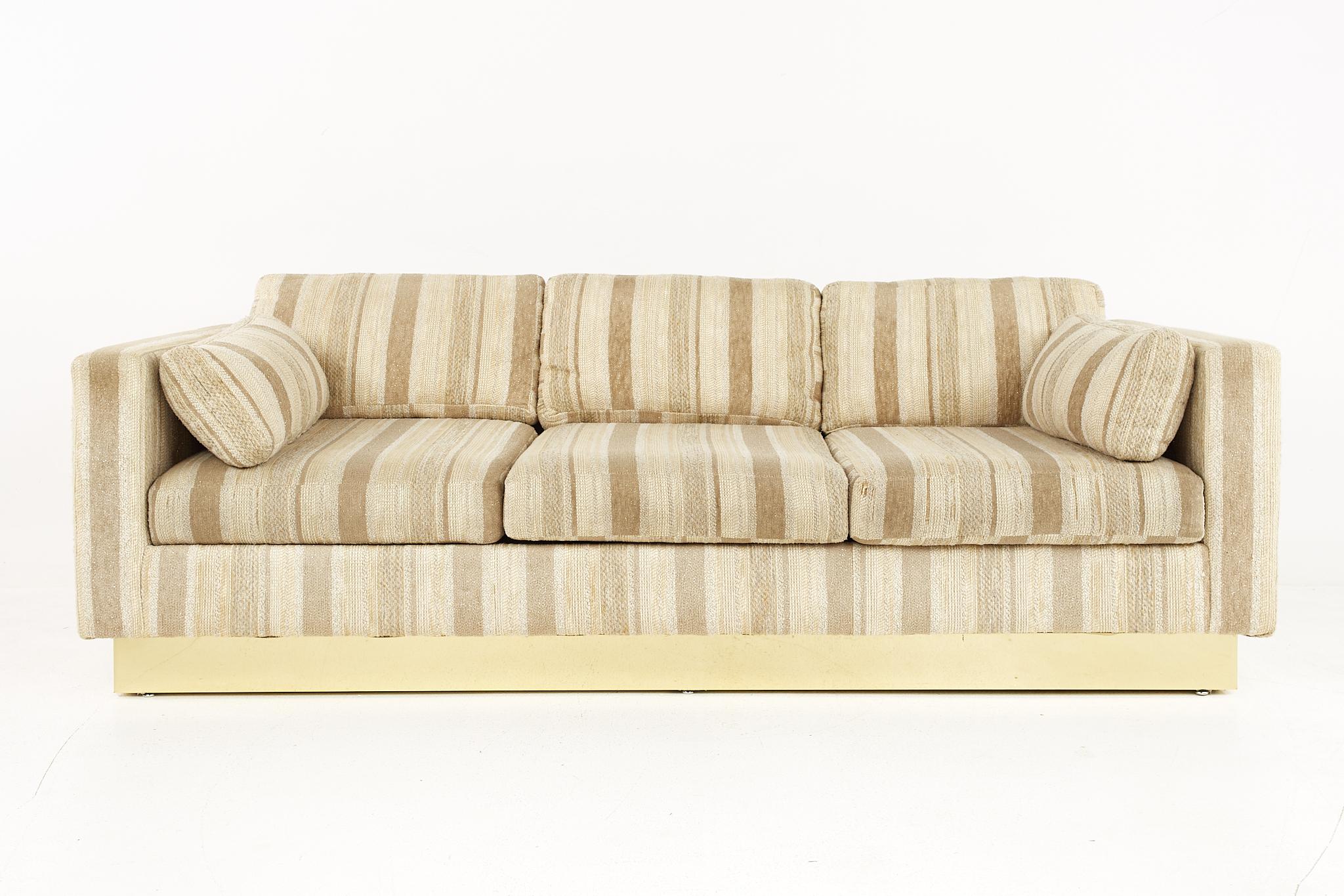 Milo Baughman style mid century brass base sofa.

The sofa measures: 83 wide x 33 deep x 29.5 high, with a seat height of 16 and arm height of 24 inches.

All pieces of furniture can be had in what we call restored vintage condition. That means