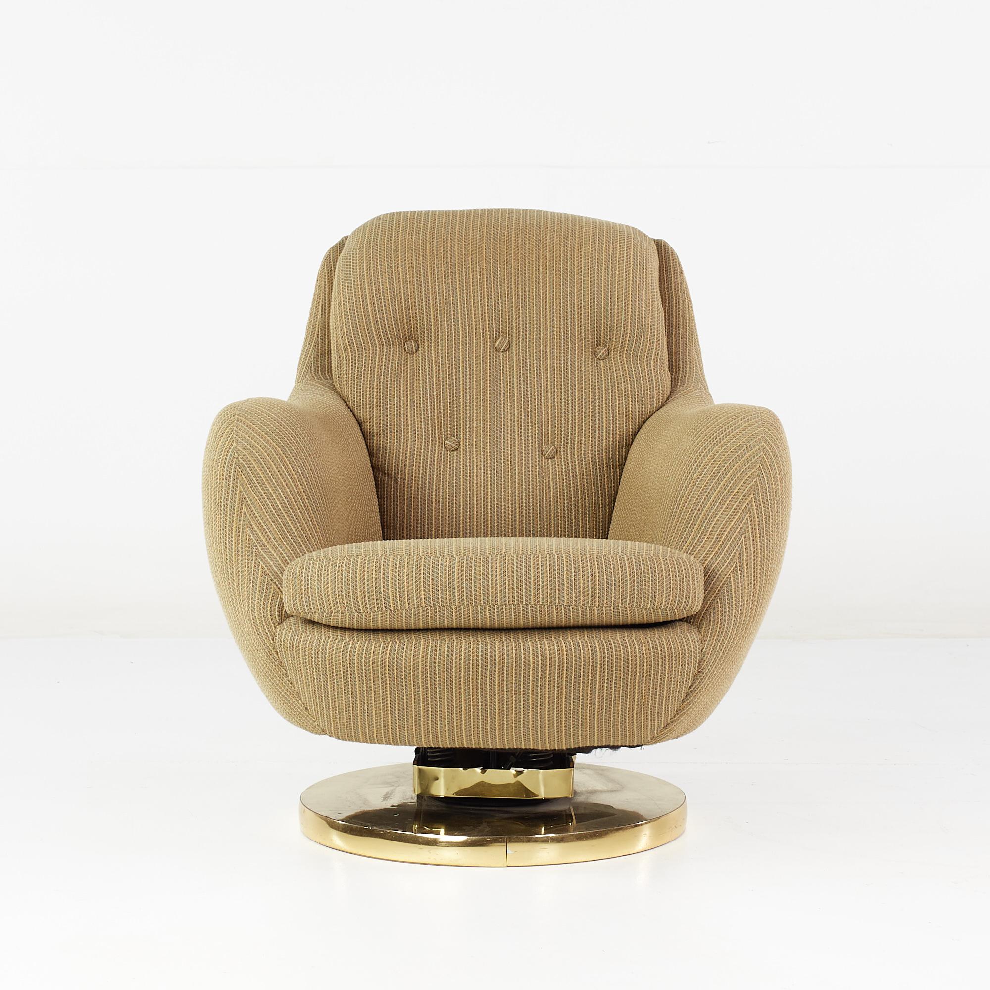 Milo Baughman Style Mid Century Brass Swivel Base Lounge Chair

This chair measures: 30 wide x 33 deep x 32 inches high, with a seat height of 16.5 and arm height/chair clearance of 23 inches

All pieces of furniture can be had in what we call