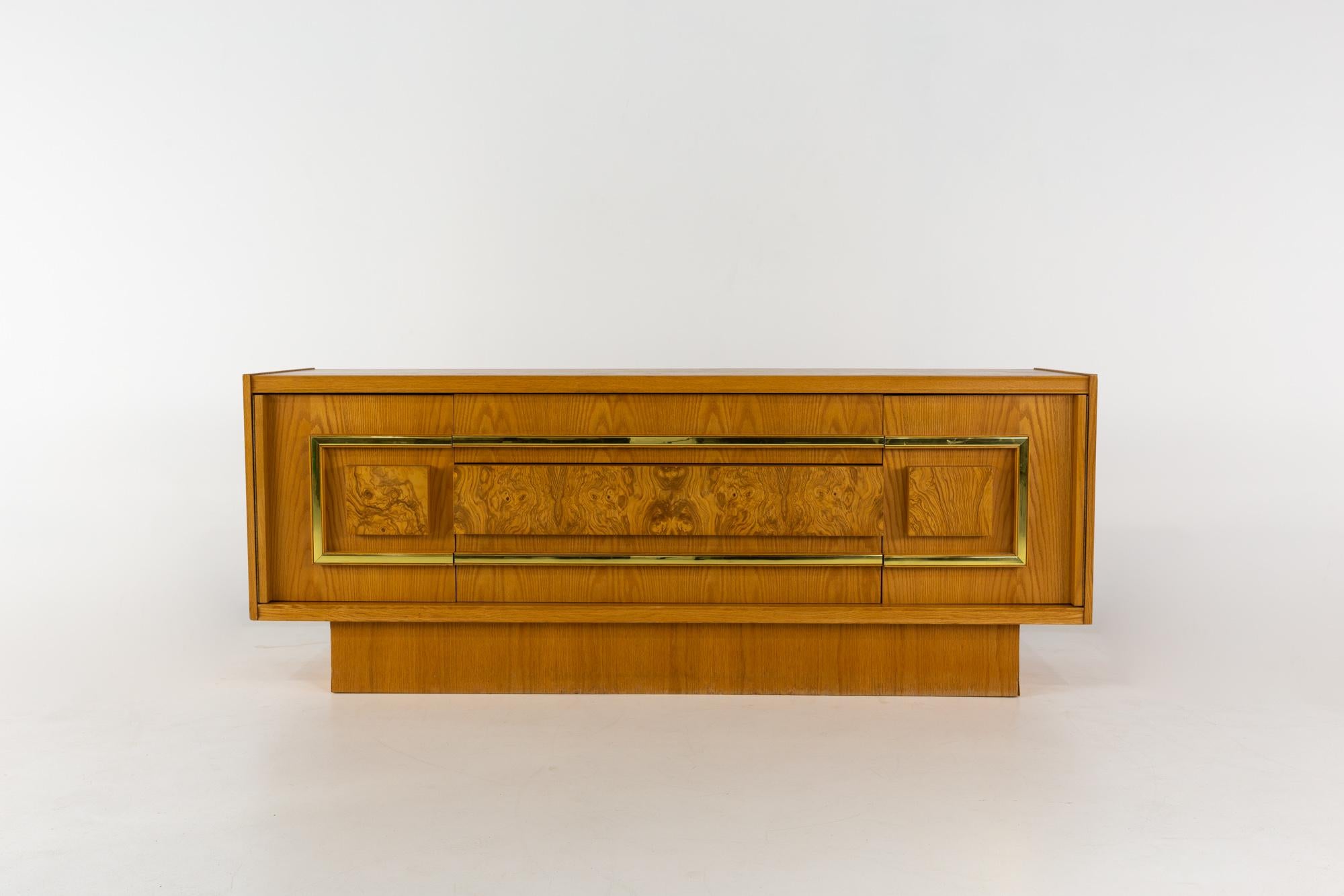 Milo Baughman Style Mid Century burlwood and brass credenza

This credenza measures: 75 wide x 20 deep x 29 inches high

All pieces of furniture can be had in what we call restored vintage condition. That means the piece is restored upon