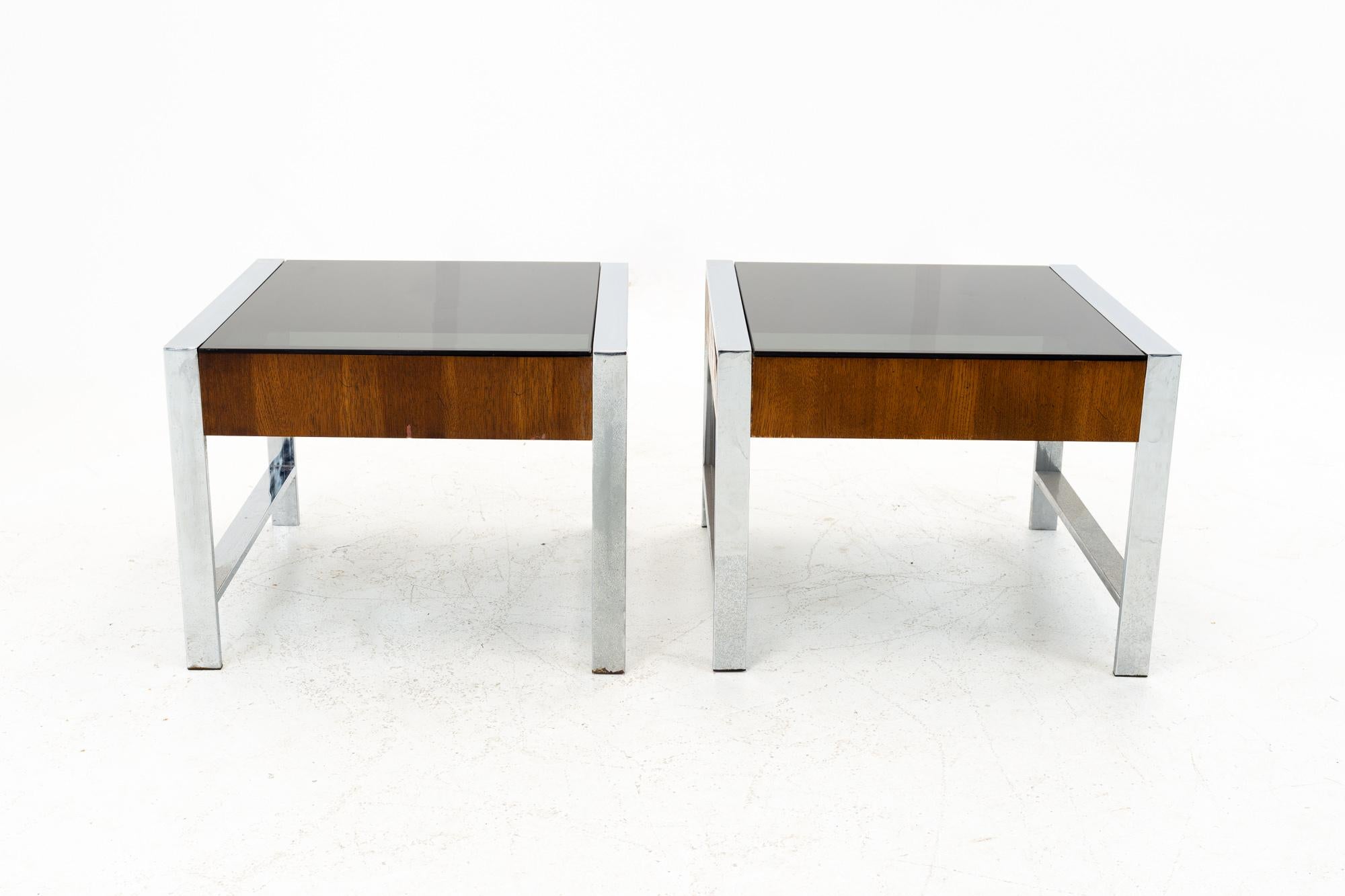 Milo Baughman Style Mid Century Chrome and Smoked Glass Side End Tables - Pair

These tables measure: 20 wide x 20 deep x 15.25 inches high

All pieces of furniture can be had in what we call restored vintage condition. That means the piece is