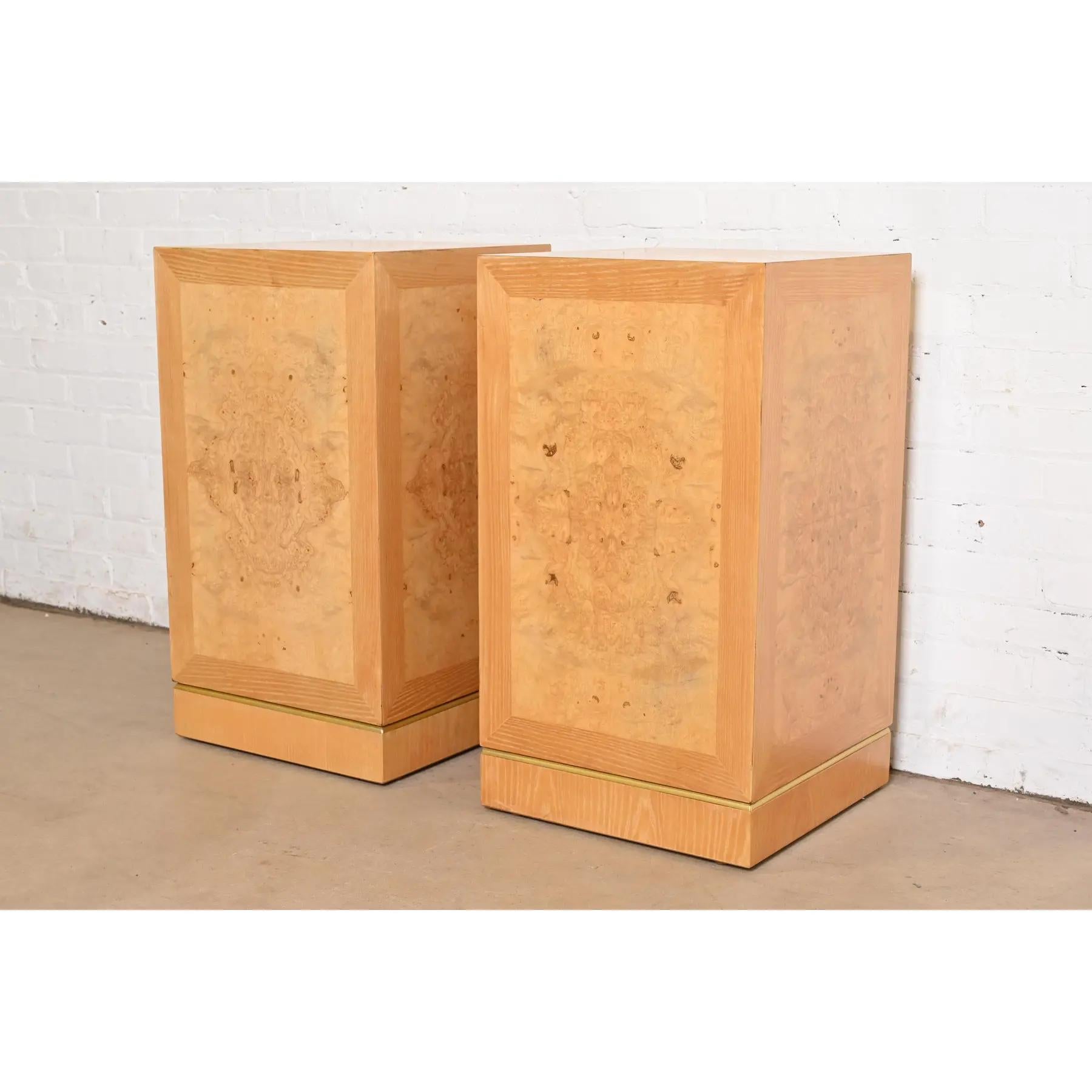 A gorgeous pair of Mid-Century Modern pedestals or plant stands

In the manner of Milo Baughman

By Drexel Heritage

USA, Circa 1970s

Beautiful book-matched burled olive wood, with ash wood banding, and brass trim.

Each measures: 16