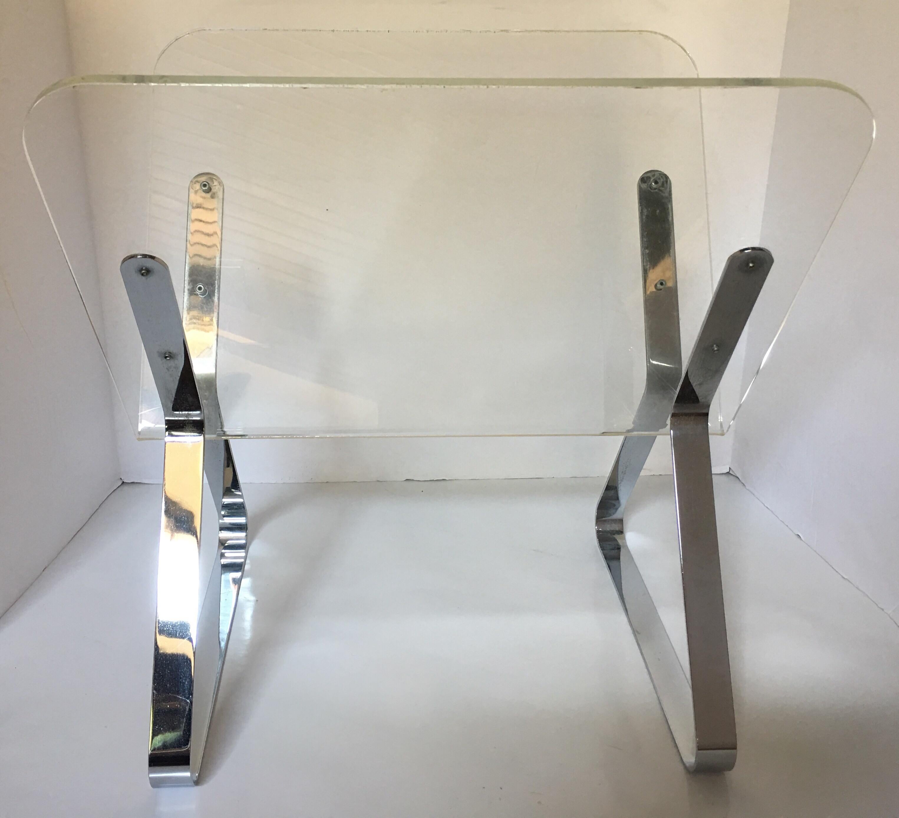 Mid-Century Modern chrome and clear Lucite magazine holder in the style of Milo Baughman.