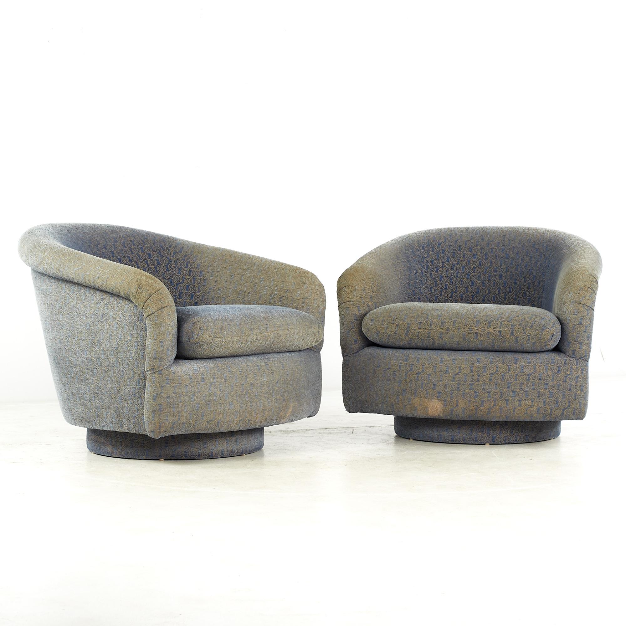Milo Baughman Style Mid Century Swivel Barrel Lounge chairs - pair

This chair measures: 34.5 wide x 36 deep x 28.5 high, with a seat height of 18 and arm height/chair clearance 24 inches

All pieces of furniture can be had in what we call