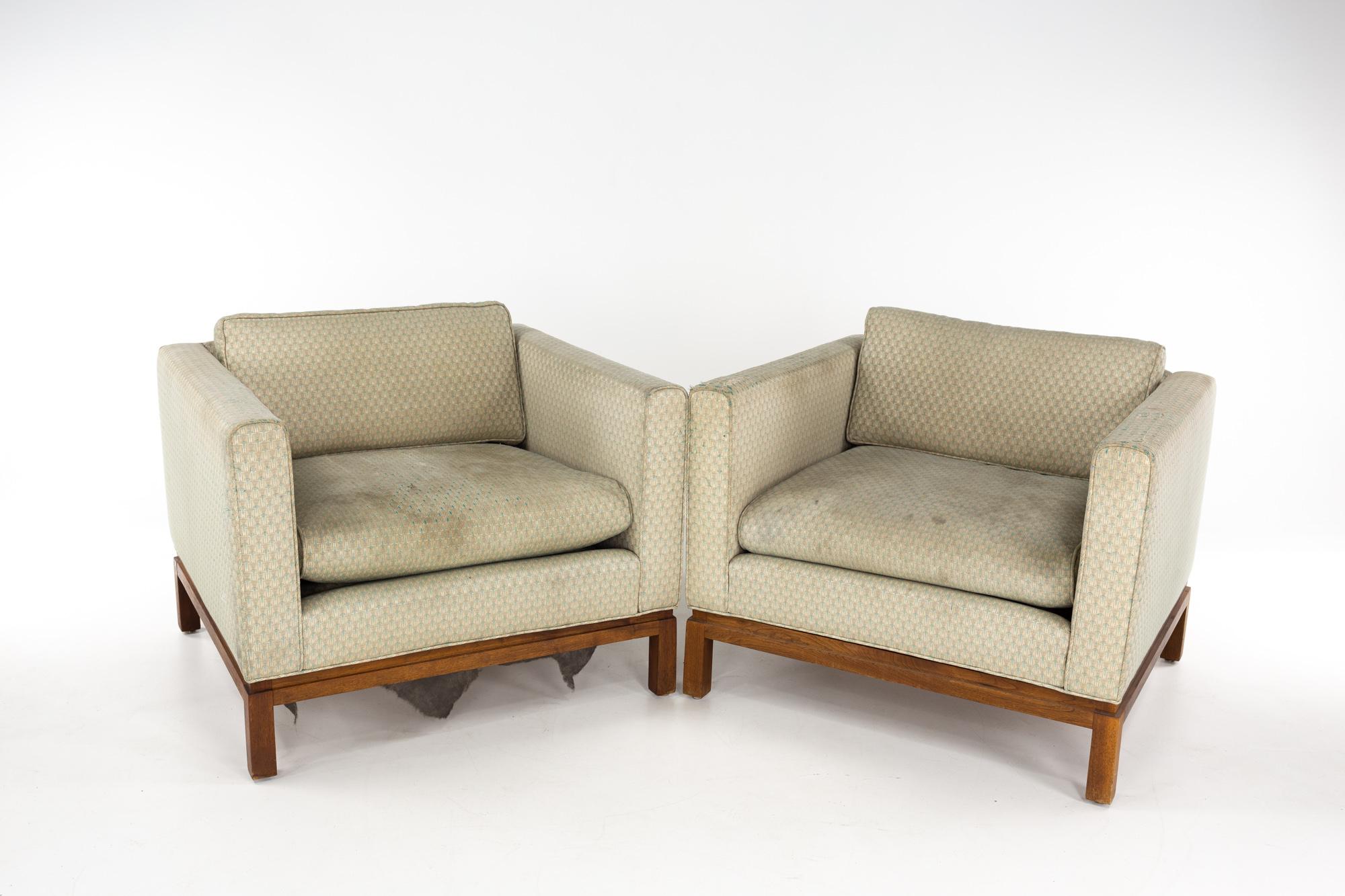 Milo Baughman style mid century walnut club chairs - a pair

Each chair measures: 34 wide x 32.5 deep x 26.5 inches high, with a seat height of 19 and arm height of 26.5 inches

Ready for new upholstery. This service is available for an