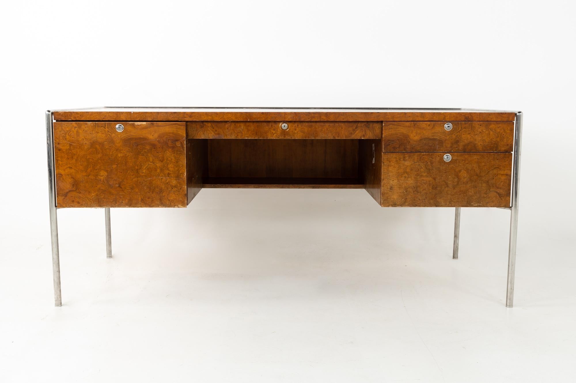 Milo Baughman style Mid Century burl wood and chrome executive desk.
This desk is 68 wide x 29.75 deep x 28.75 inches high

All pieces of furniture can be had in what we call restored vintage condition. This means the piece is restored upon purchase