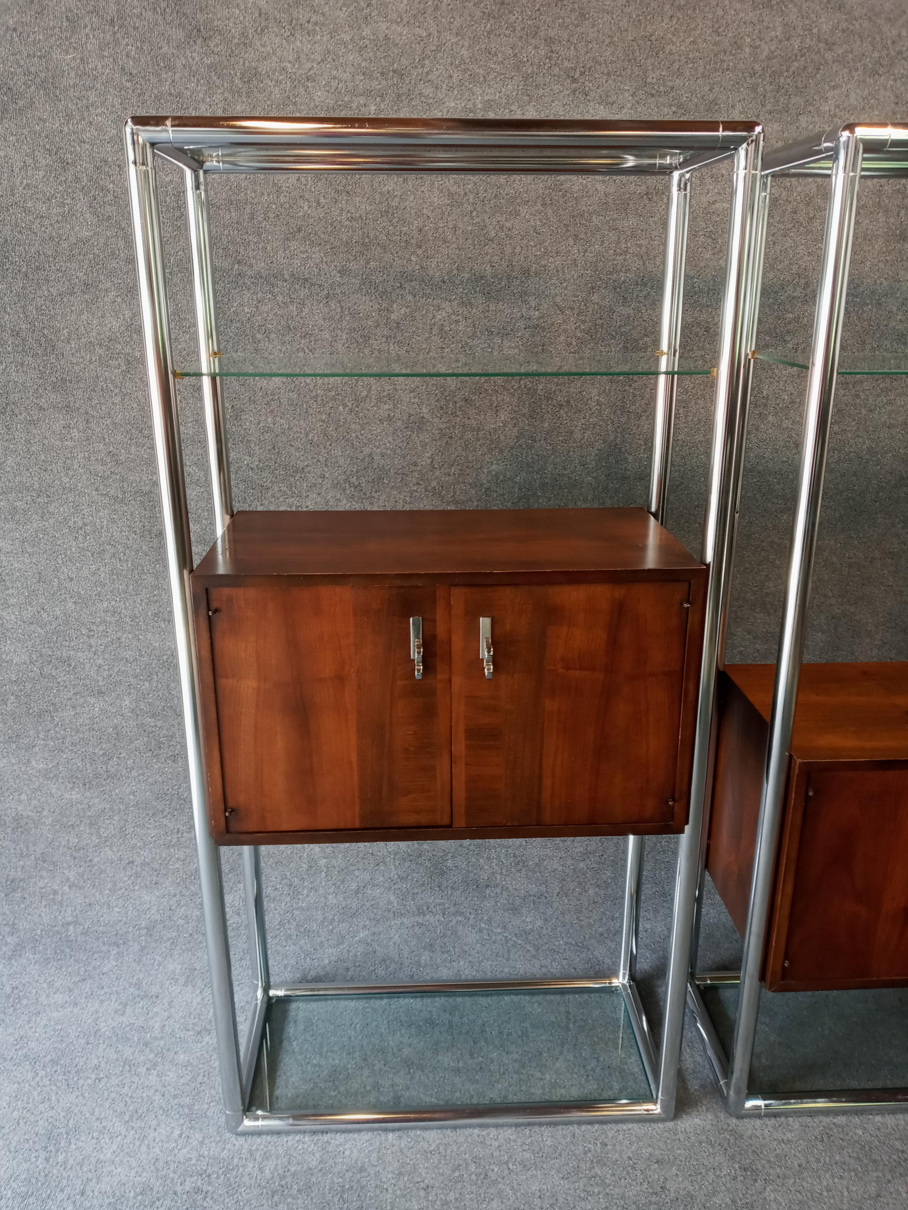 Pair of elegant and practical chrome framed and walnut cased etageres by Lane, Each with adjustable glass shelving. Very well made, sturdy and stable. 

The chrome is clean and bright. The satin sheen finish on the walnut is original with only minor