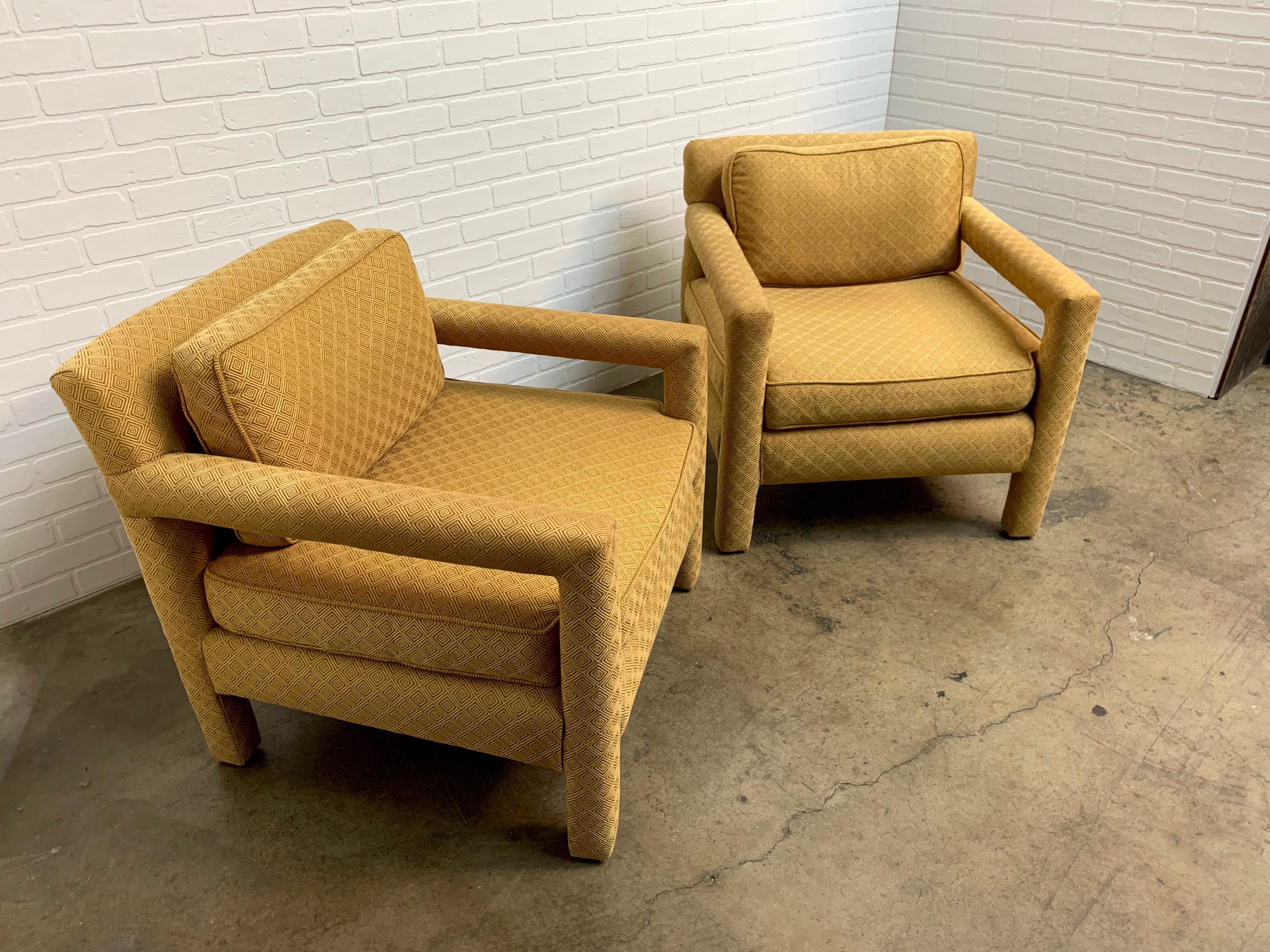 Pair of very comfortable Parsons lounge chairs. Made of solid oak frames with geometric pattern fabric in the style of Milo Baughman.