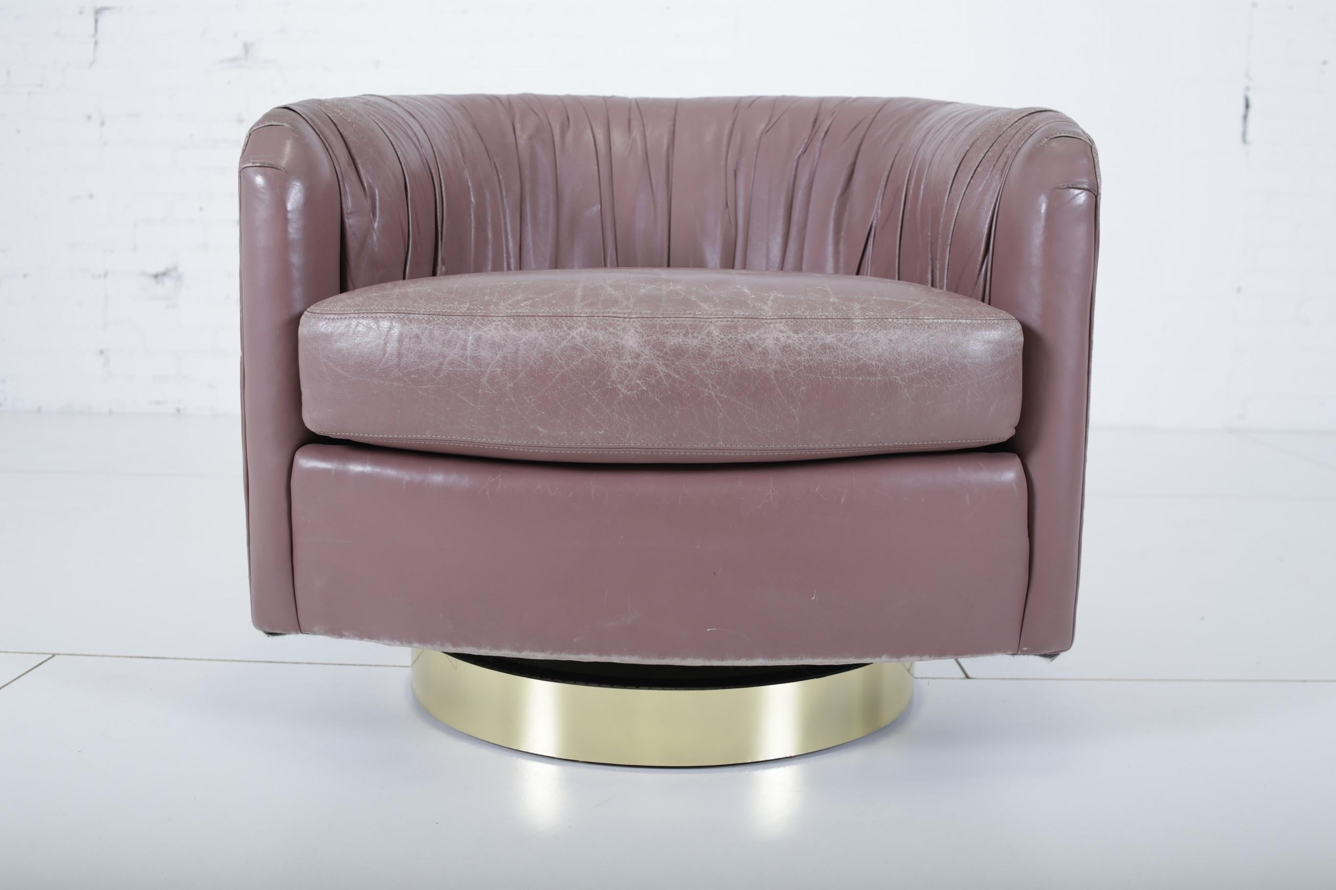 Swivel chair by Milo Baughman. Reupholstered in pleated leather in the 1980s. Least her is vintage and shows wear.
