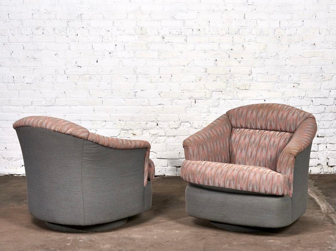 Milo Baughman Swivel Chairs for Directional, 1980. Original pink and grey post modern upholstery with upholstered plinth base.

