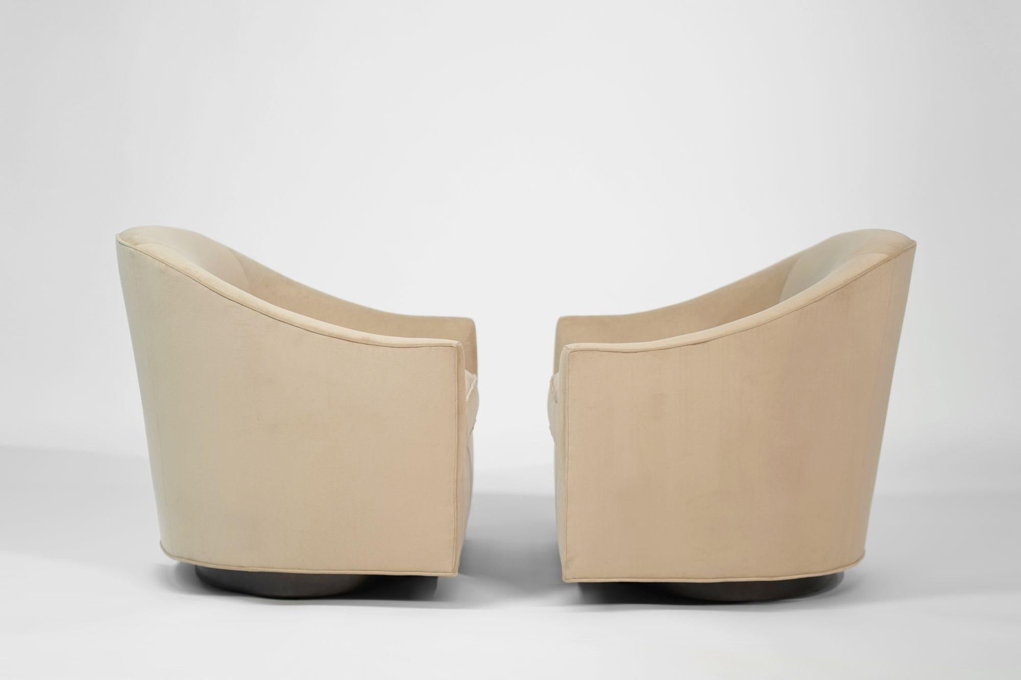 Set of vintage swivel chairs by Milo Baughman, expertly restored by Stamford Modern. Featuring newly refinished bronze swivel bases and reupholstered in luxurious natural velvet, these chairs combine Mid-Century sophistication with modern comfort.