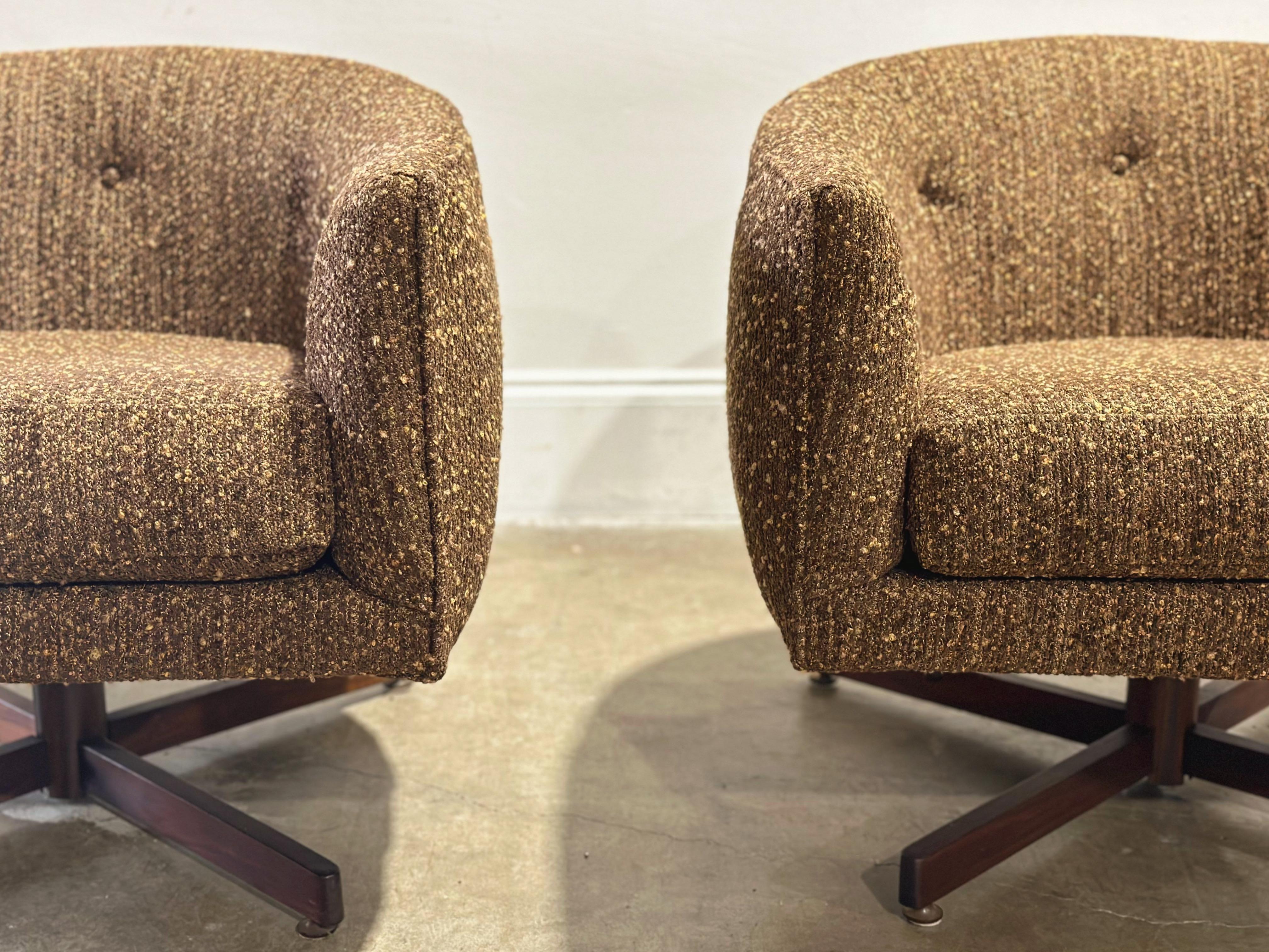Pair of midcentury modern barrel loungers by Milo Baughman for Thayer Coggin - on rare black walnut four spoke bases. 

swivel + rock + recline

Both chairs retain both Thayer Coggin labels

Fully restored by our in-house team. All new foam,