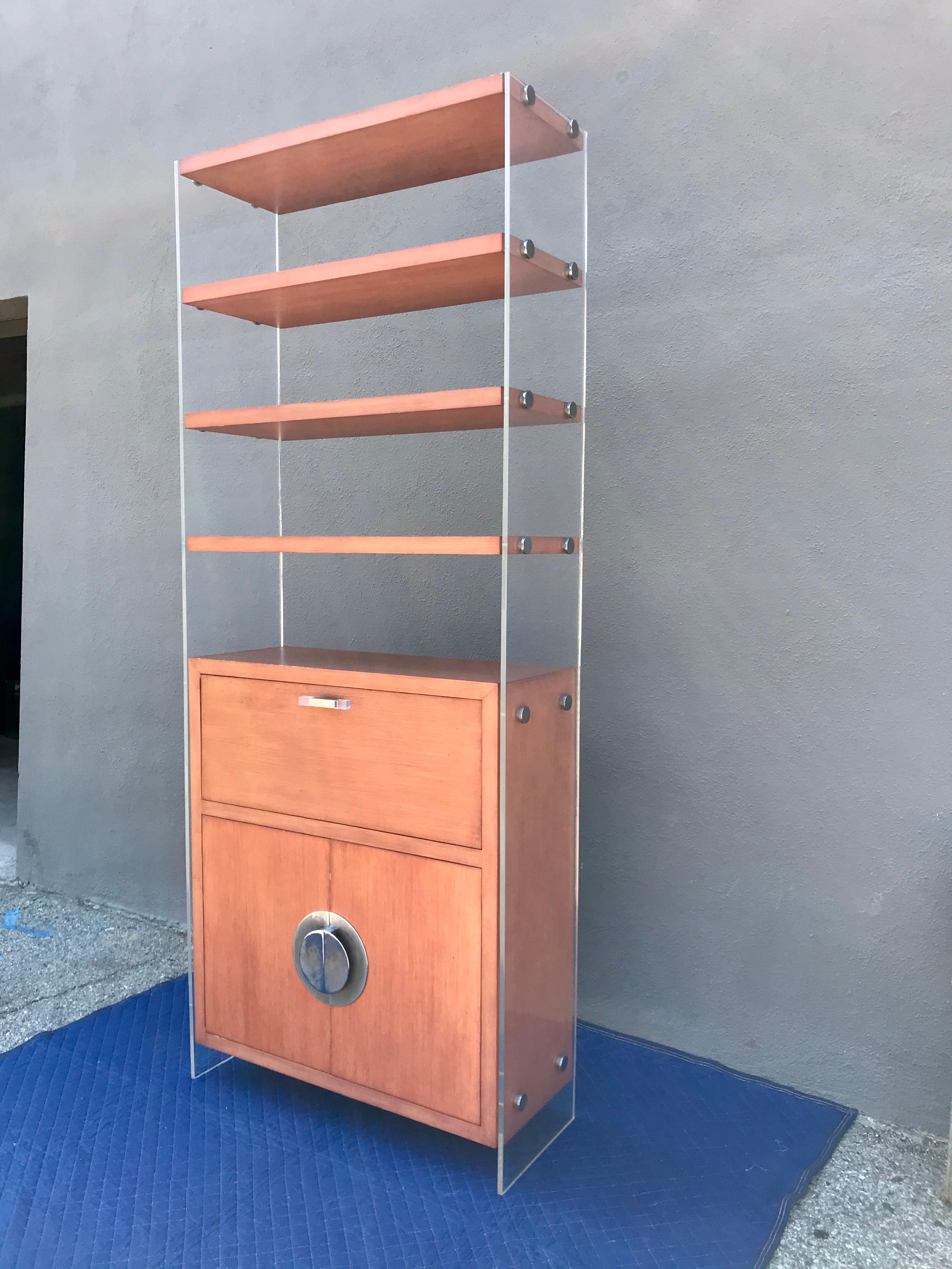 A timeless architectural design.
Lacquered plywood with Lucite and steel hardware.
Great for many uses; design accent, storage, display small art objects, and even a dry bar.
Original vintage condition, no damage or repairs, minor wear (barely