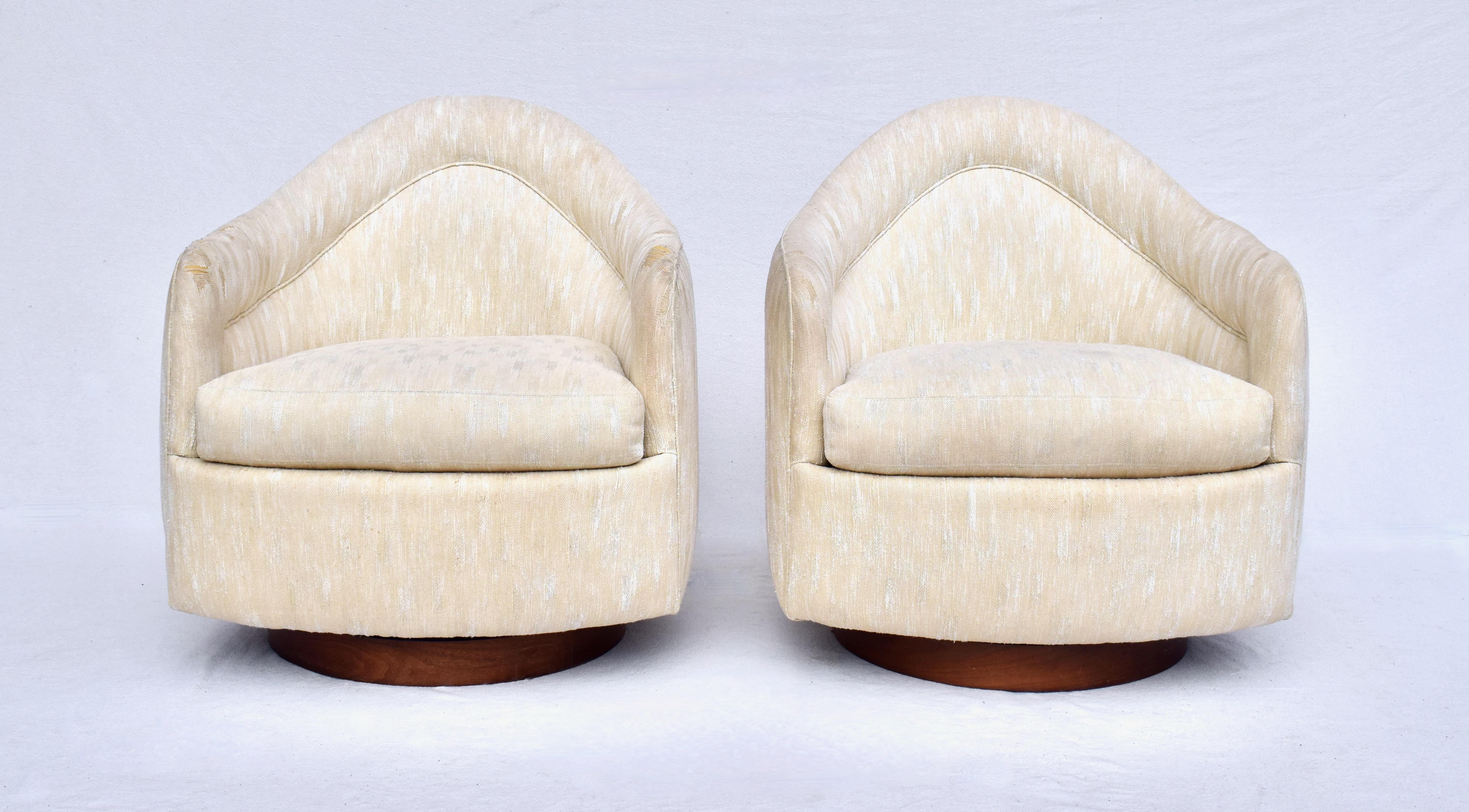 A pair of Milo Baughman for Thayer Coggin Teardrop swivel chairs in all original & structurally well maintained condition. Gorgeous walnut bases, each chair maintains its' original Thayer Coggin tag. Seats: 17.5