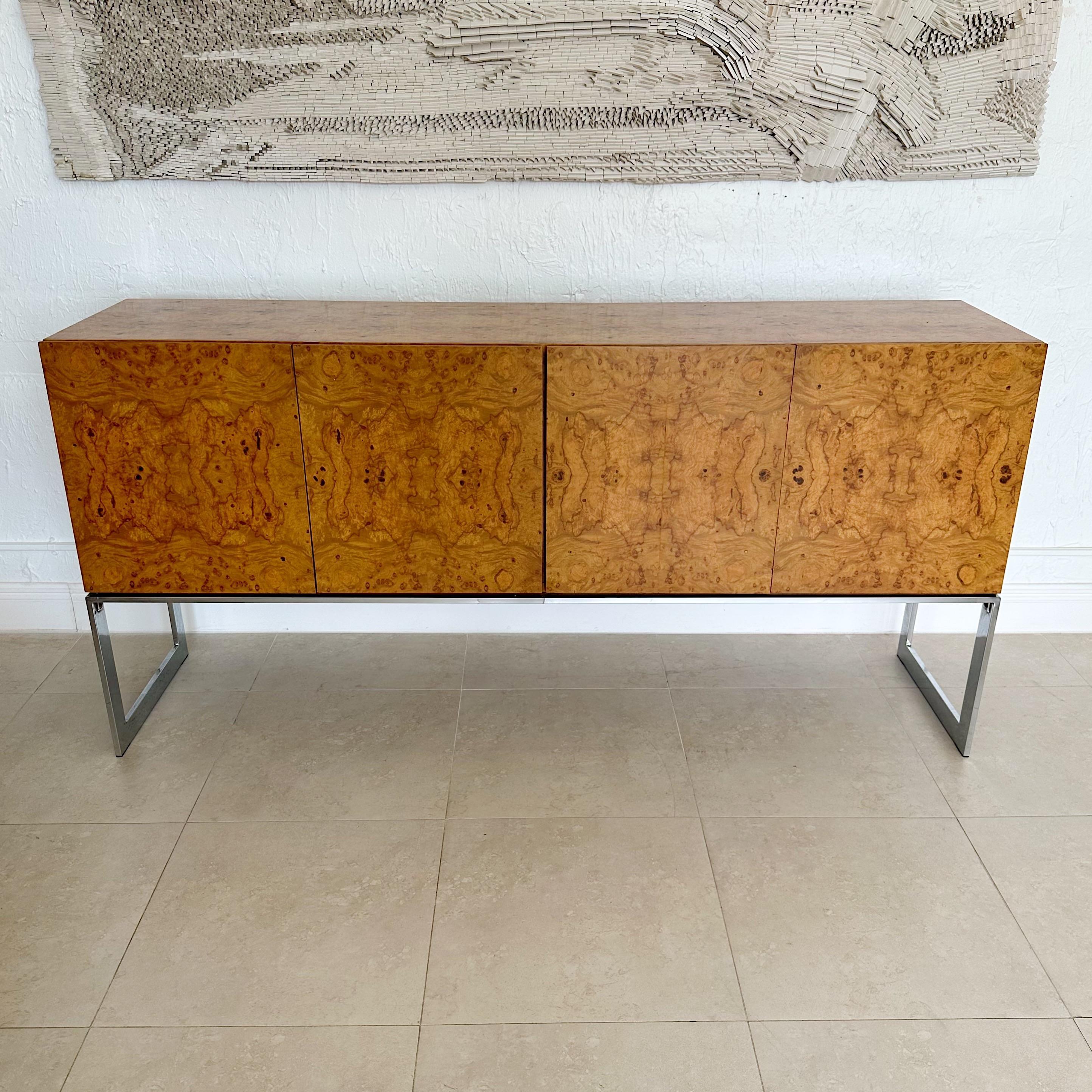 Milo Baughman designed for Thayer Cogging matched burl wood four door credenza, sideboard from the early 1970's. Interior on left side has one glass shelf and the right side has one interior drawer. Fully restored close to original condition,