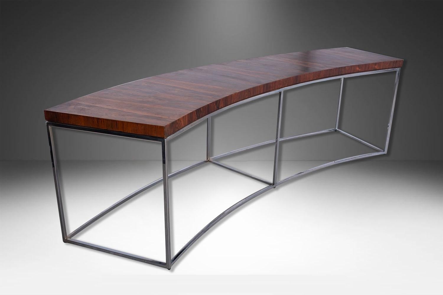 A handsome, sleek Modern curved console, sofa table / bench designed in the 1970's by Milo Baughman made by Thayer Coggin. An exceptional table both for its form and quality. Featuring a beautifully curved tabletop in rosewood veneer, resting on a